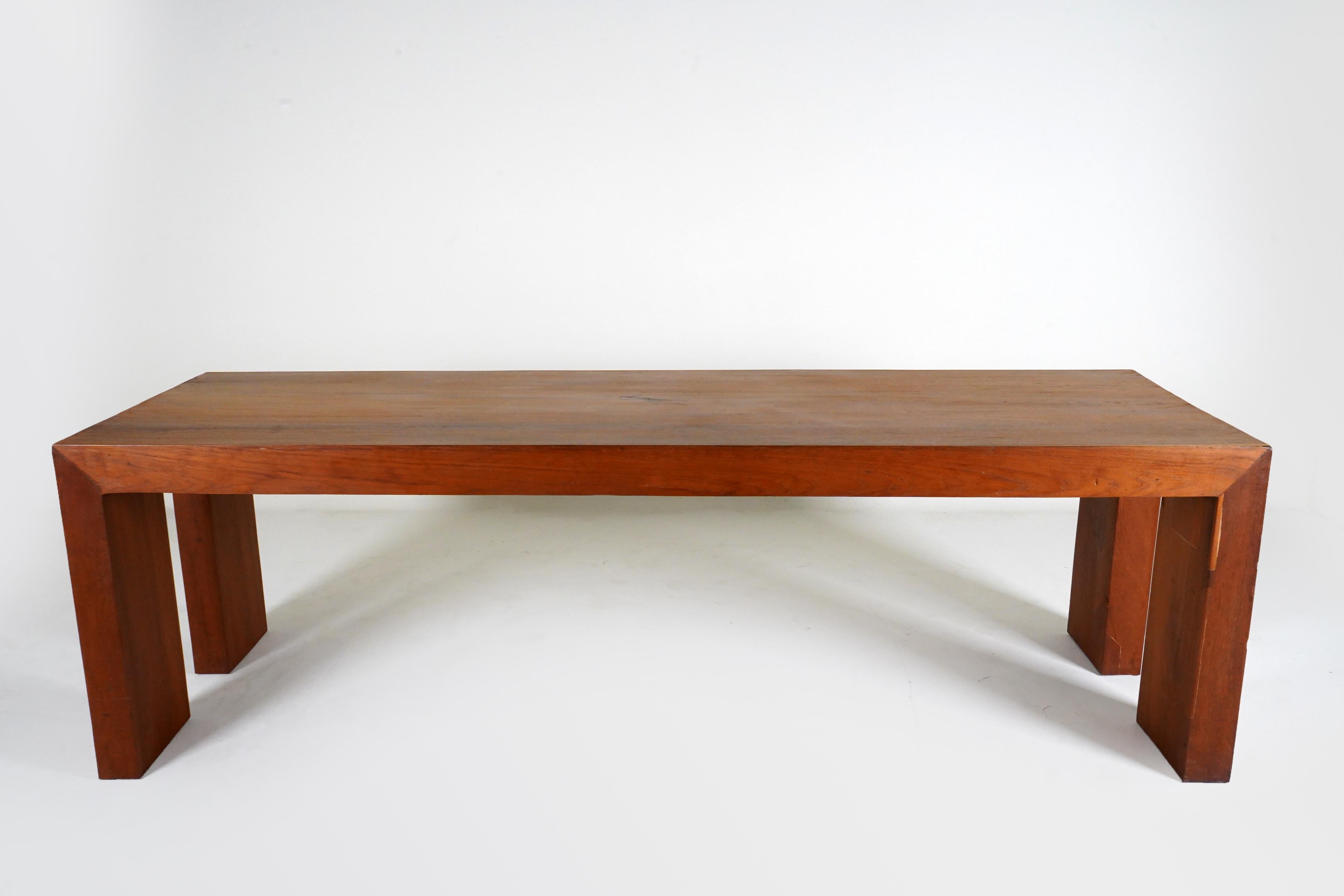 This simple and elegantly angular dining table is made from reclaimed teakwood in Chiang Mai, Thailand. The design is based on 1950's modern designs popular in Southeast Asia after WWII.