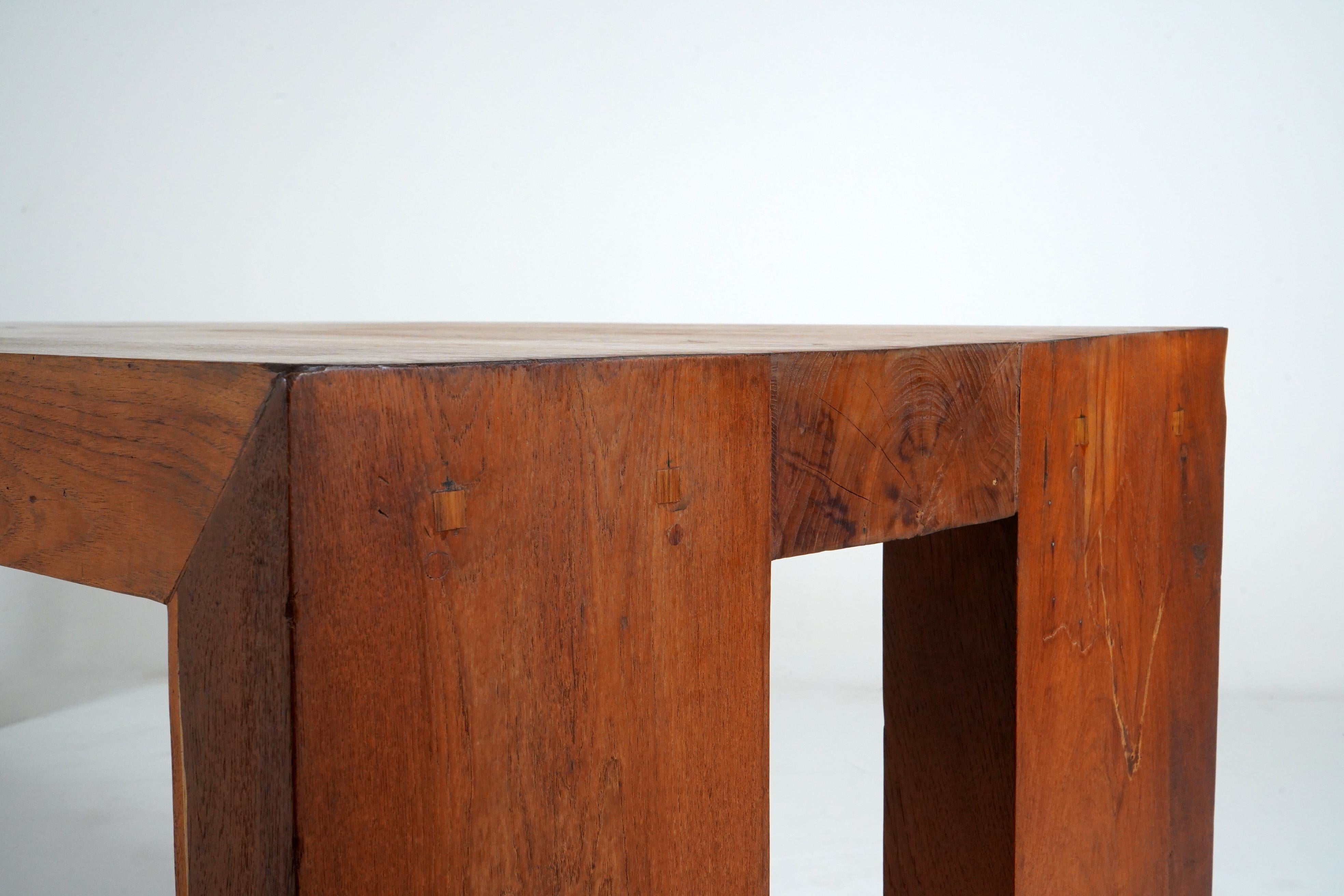 A Monumental Teakwood Dining Table In Good Condition For Sale In Chicago, IL