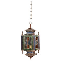 A Moorish Hanging Lantern with Coloured Glass Panels