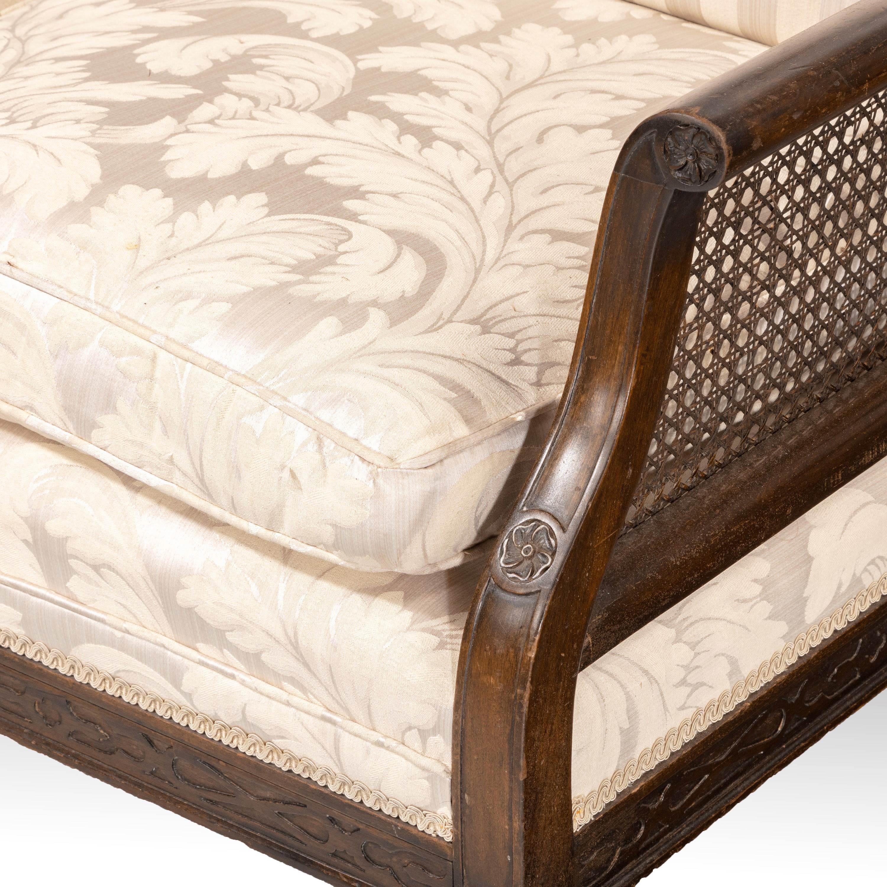 Can be matched with our item ref code 8824. A most attractive walnut framed bergère sofa. The double hooped top with a centre cartouche. Carved cabriole supports on paw feet.
Measures: Seat height 19