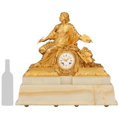 A most decorative French 19th century Louis XVI st. Onyx and Ormolu mantel clock
