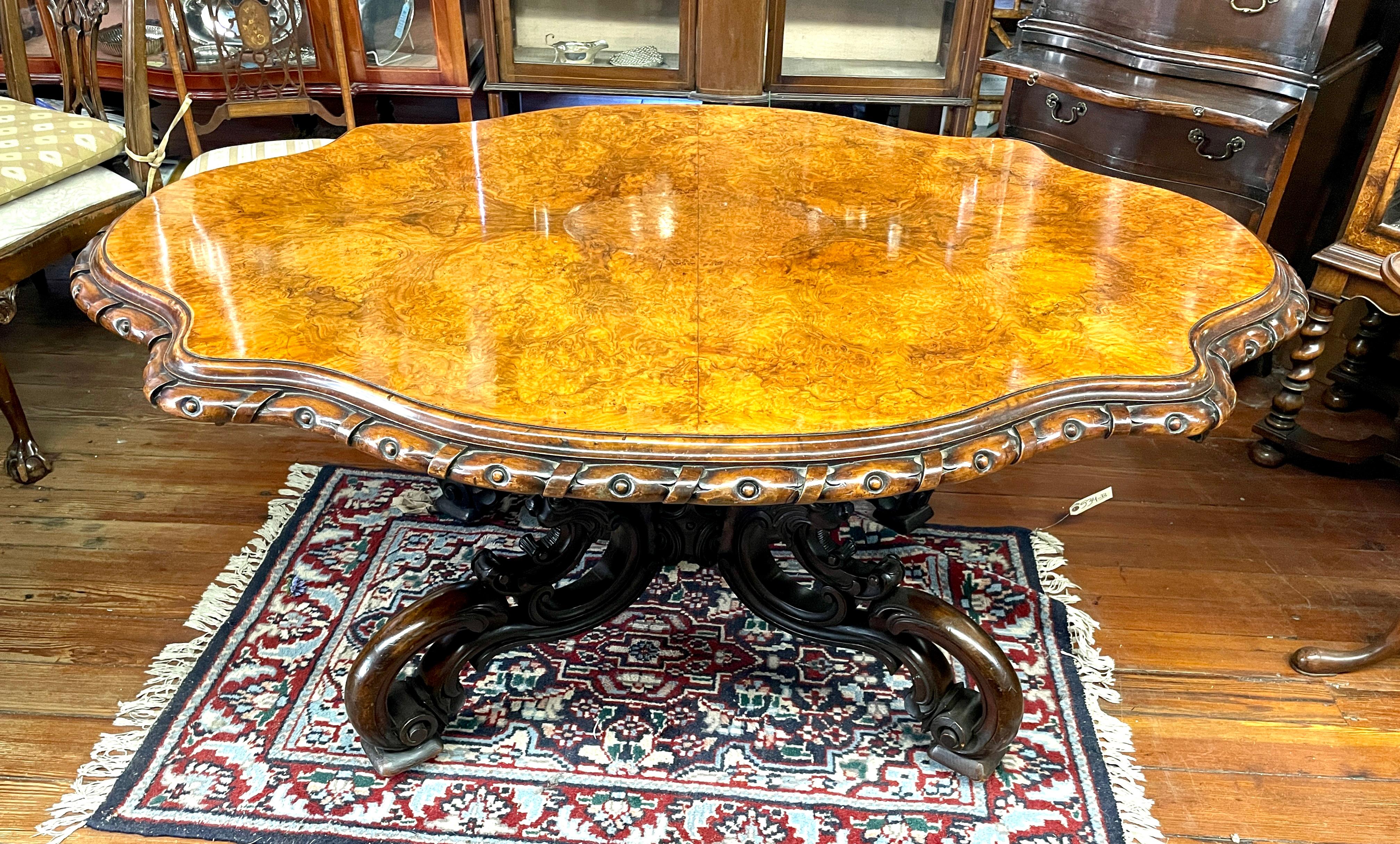Of all of the Antique English burr walnut Loo, Centre or Breakfast Table we have ever sold, this may be the finest, most exquisite one ever found on a UK buying trip.  The top is magnificently shaped with an extraordinary belt or rope-carved edge