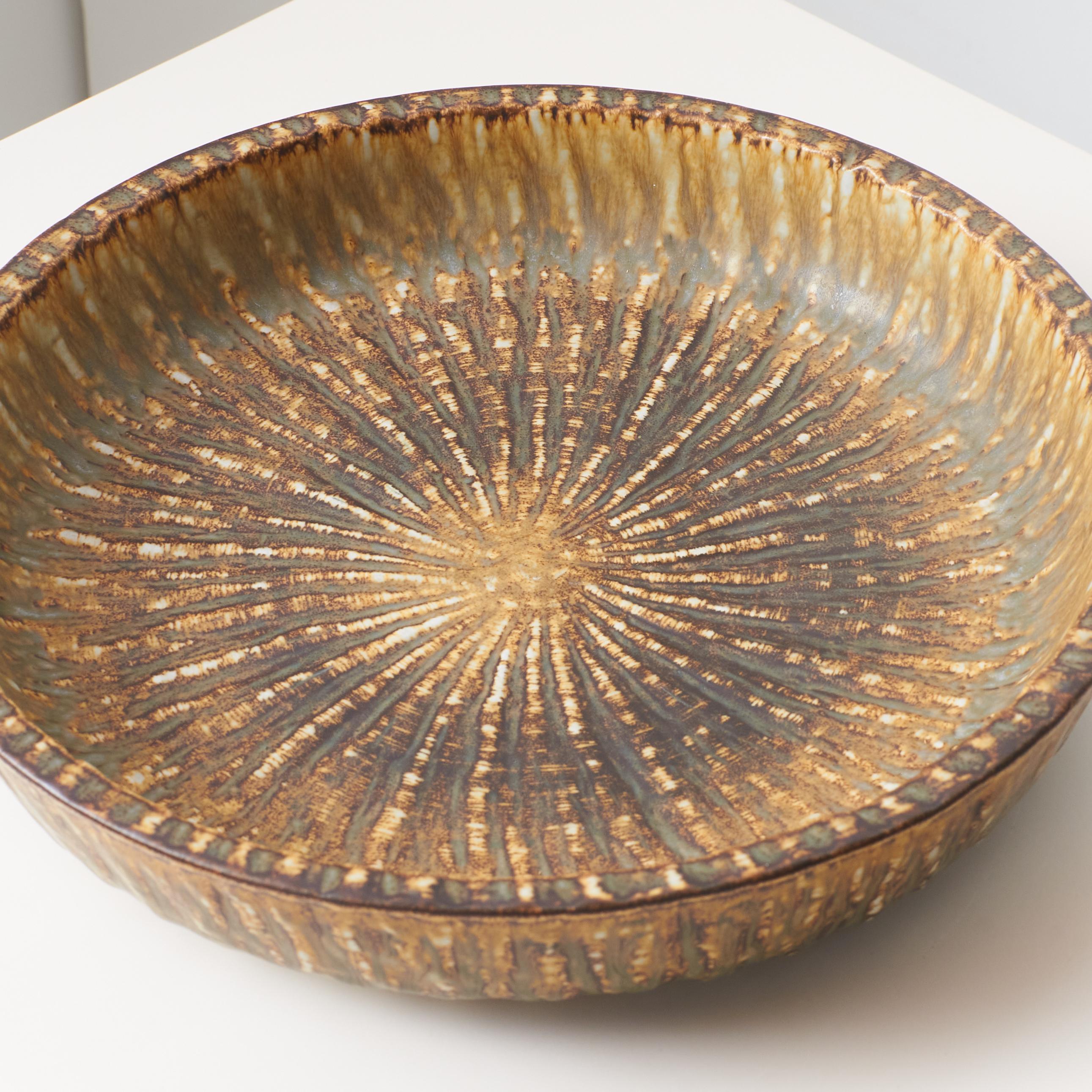 Swedish A mottled brown and yellow deep sided round shaped dish by Gunnar Nylund For Sale