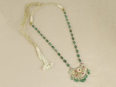 A Mughal Gem-set Indian Jade pendant inlaid with gold diamond, ruby and emeralds