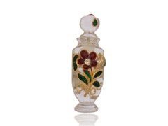 A Mughal Natural Rock Crystal Perfume Flask inlaid with gold and rubies