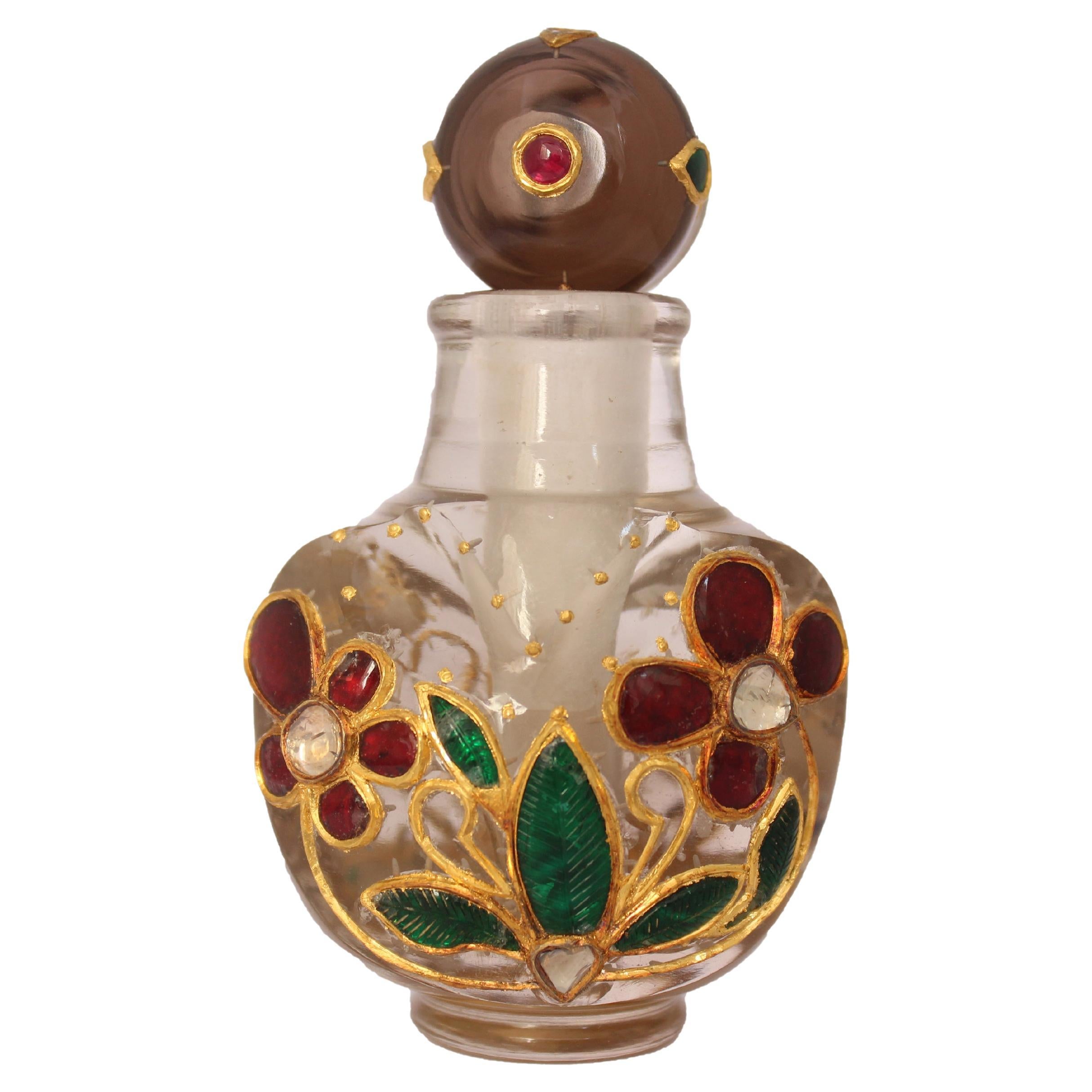 Frasco de perfume mogol de cristal de roca natural con incrustaciones de oro y rubíes