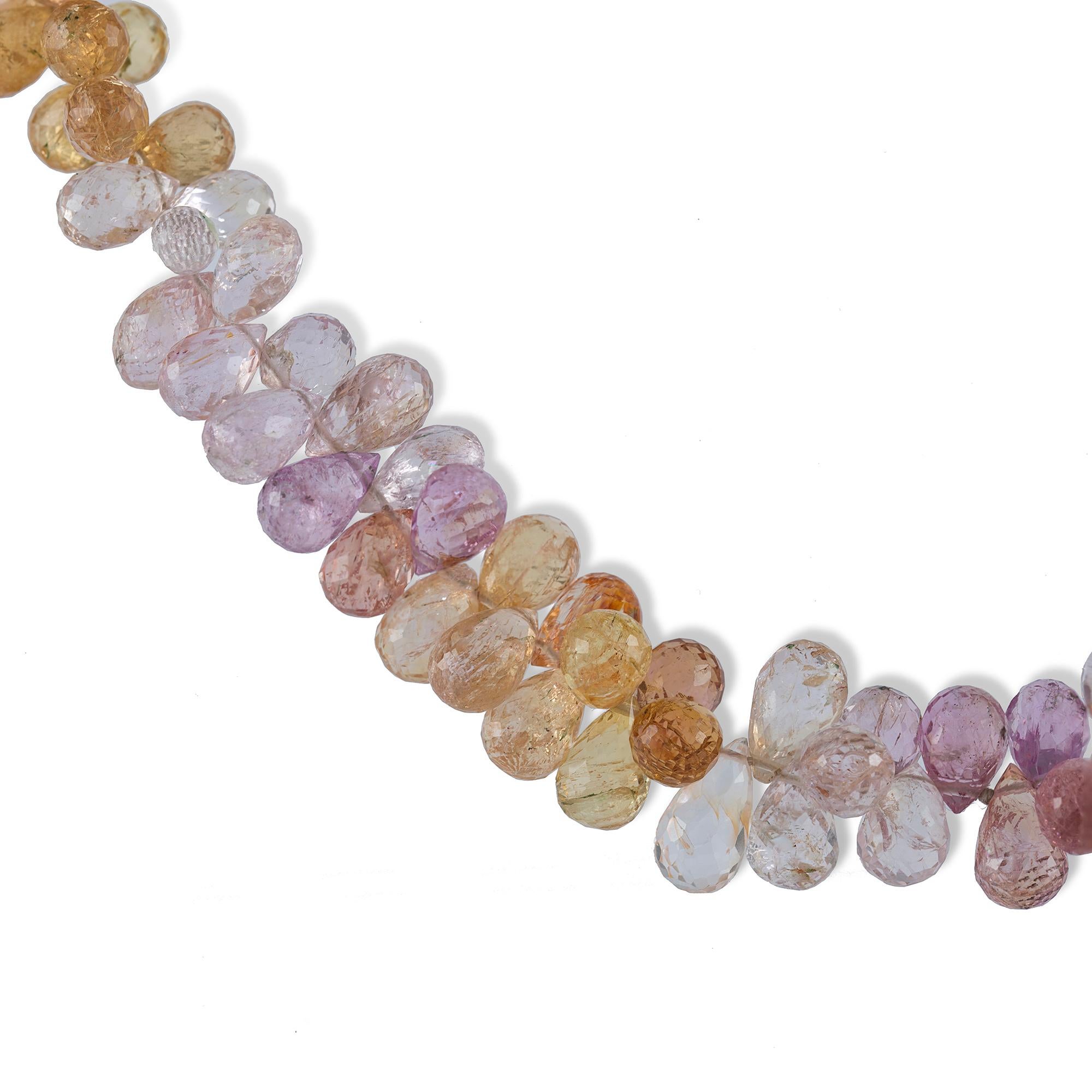 A multi-colour topaz briolette bead necklace, graduating from the centre in pink, white, yellow and orange to a 9ct yellow gold barrel clasp, gross weight 54.0 grams

This bold topaz necklace comes from the collection of Bentley & Skinner, the