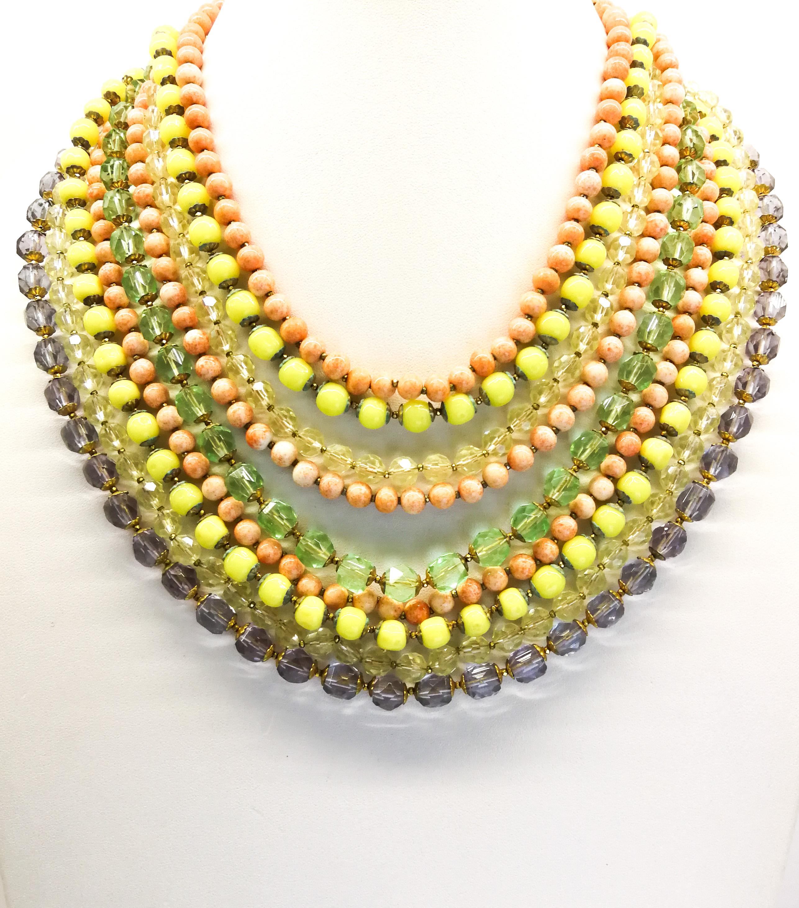 A bright and cheerful large glass bead necklace and matching earrings, with clear faceted and opaque smooth beads, a Summery mix of coral, lemon, citrine , amethyst and mint hues, falling one row loosely on top of the other, from the 1950s. The