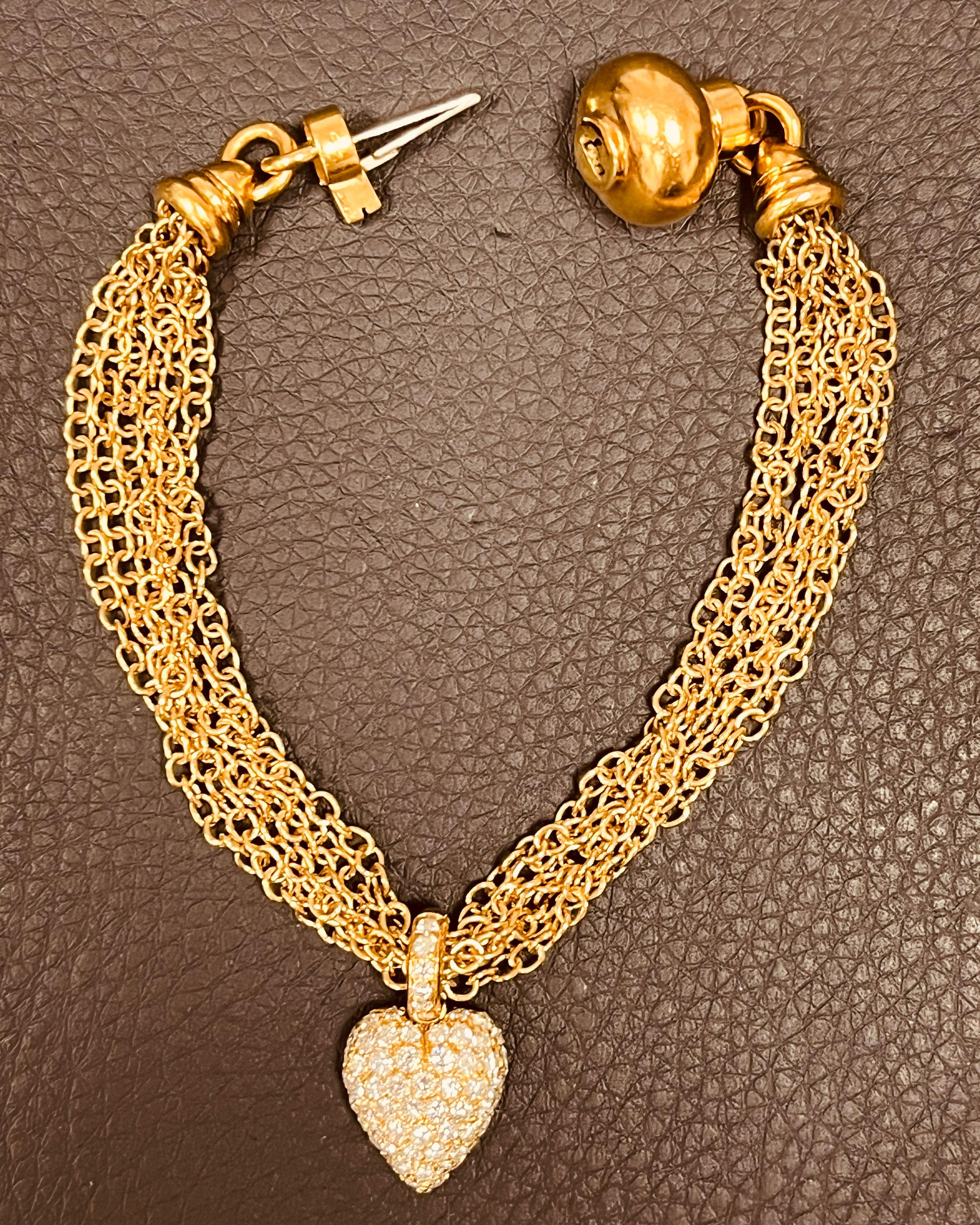 A multi strand 18ct gold bracelet- the 6 chains held together with a diamond pave heart with approximately 1.30ct diamonds of G/H VS clarity. Total weight: 21.2 grams. Italian control marks Marked 750 for 18ct. 18cm length. Diamond heart 18mm x 12