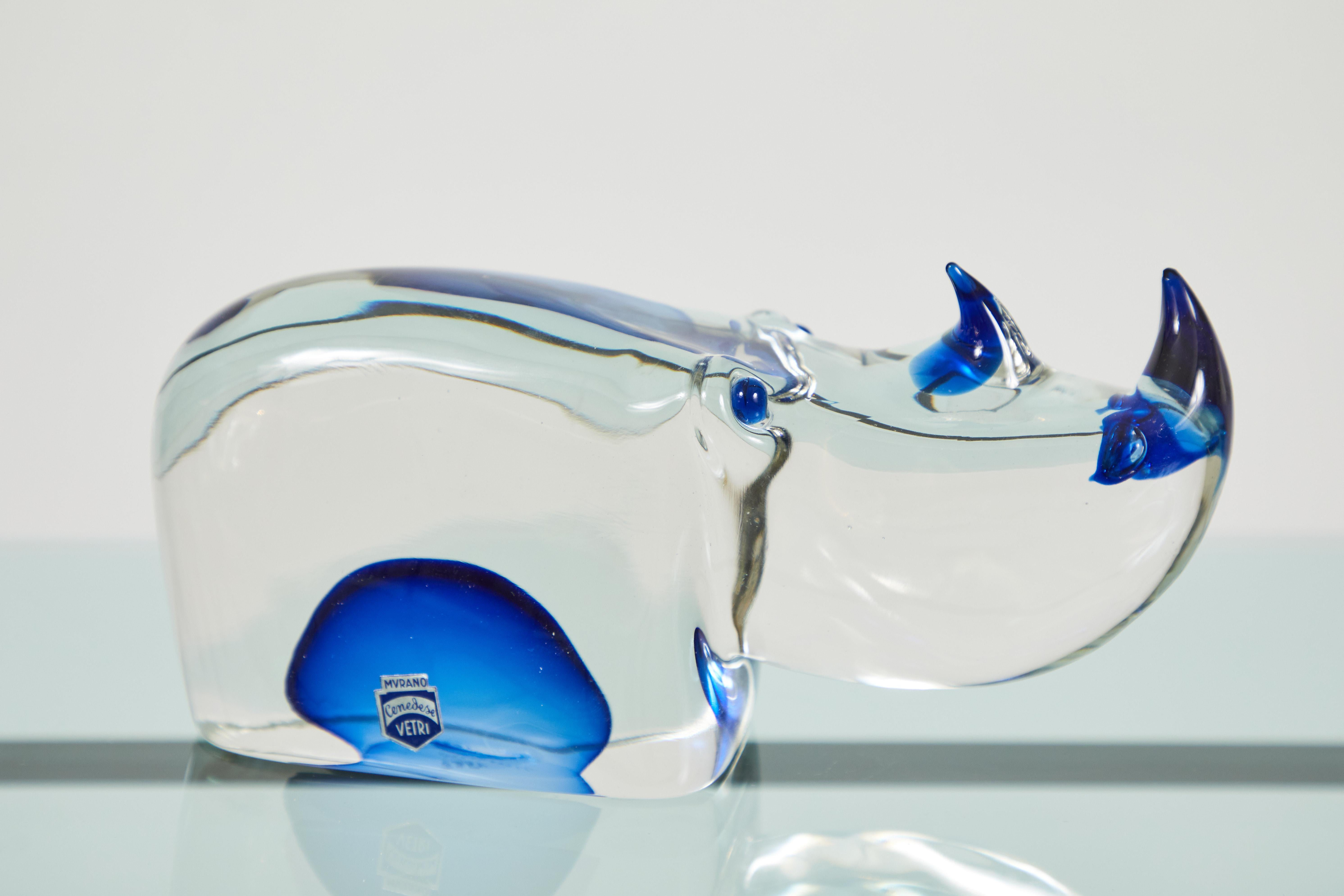 This is a beautifully blown, somerso Murano glass rhinoceros. This piece was designed by Antonio Da Ros and blown by Fabio Tosi for Cenedese Vetri. The horns, nostrils, eyes and belly feature a deep cobalt blue somerso glass. The piece is signed and