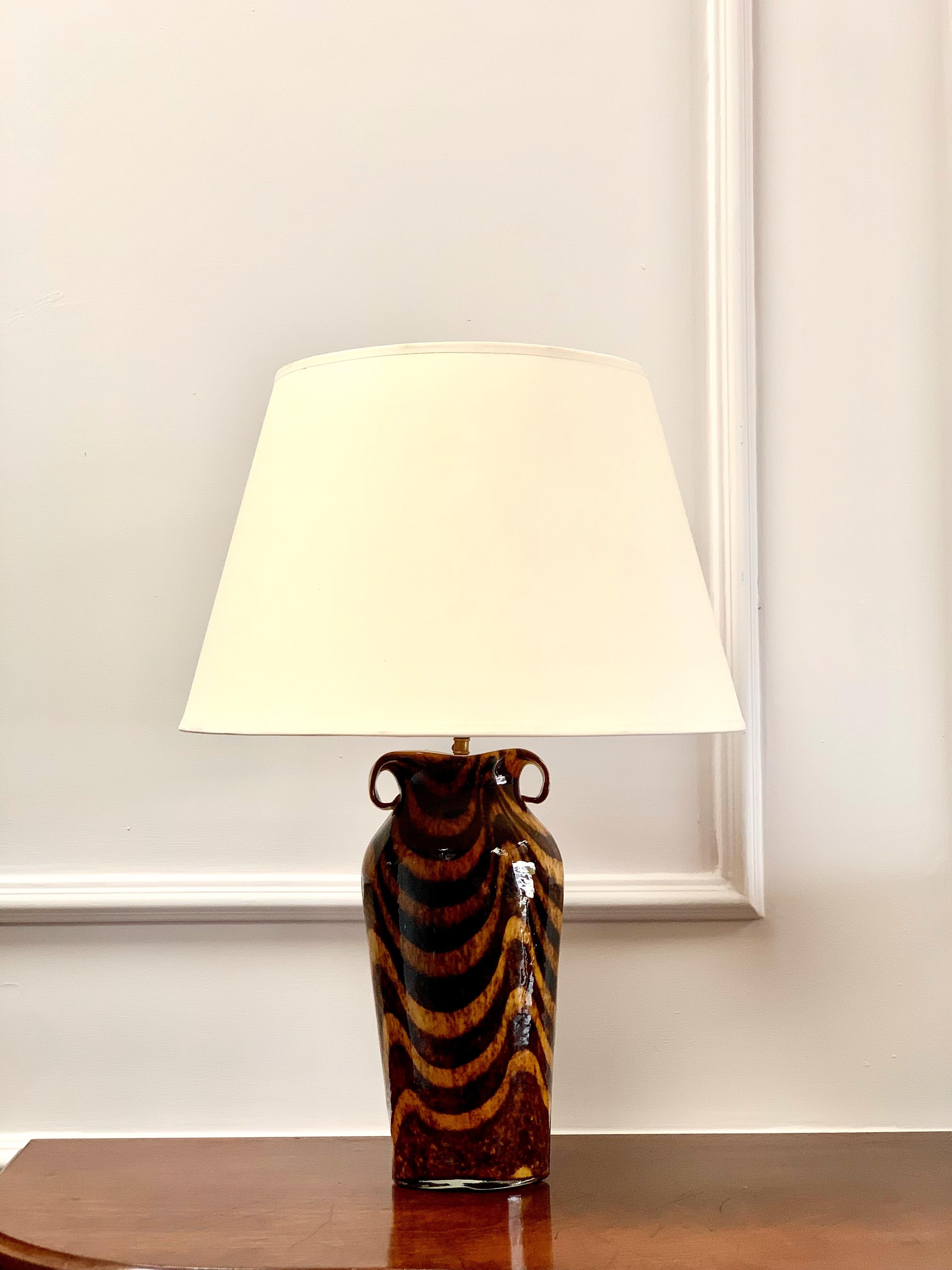 A Flamboyant murano vase with asymmetrical twin loop handles and deep rich colour, now as a lamp. 

Italian, Mid-20 Century.

 