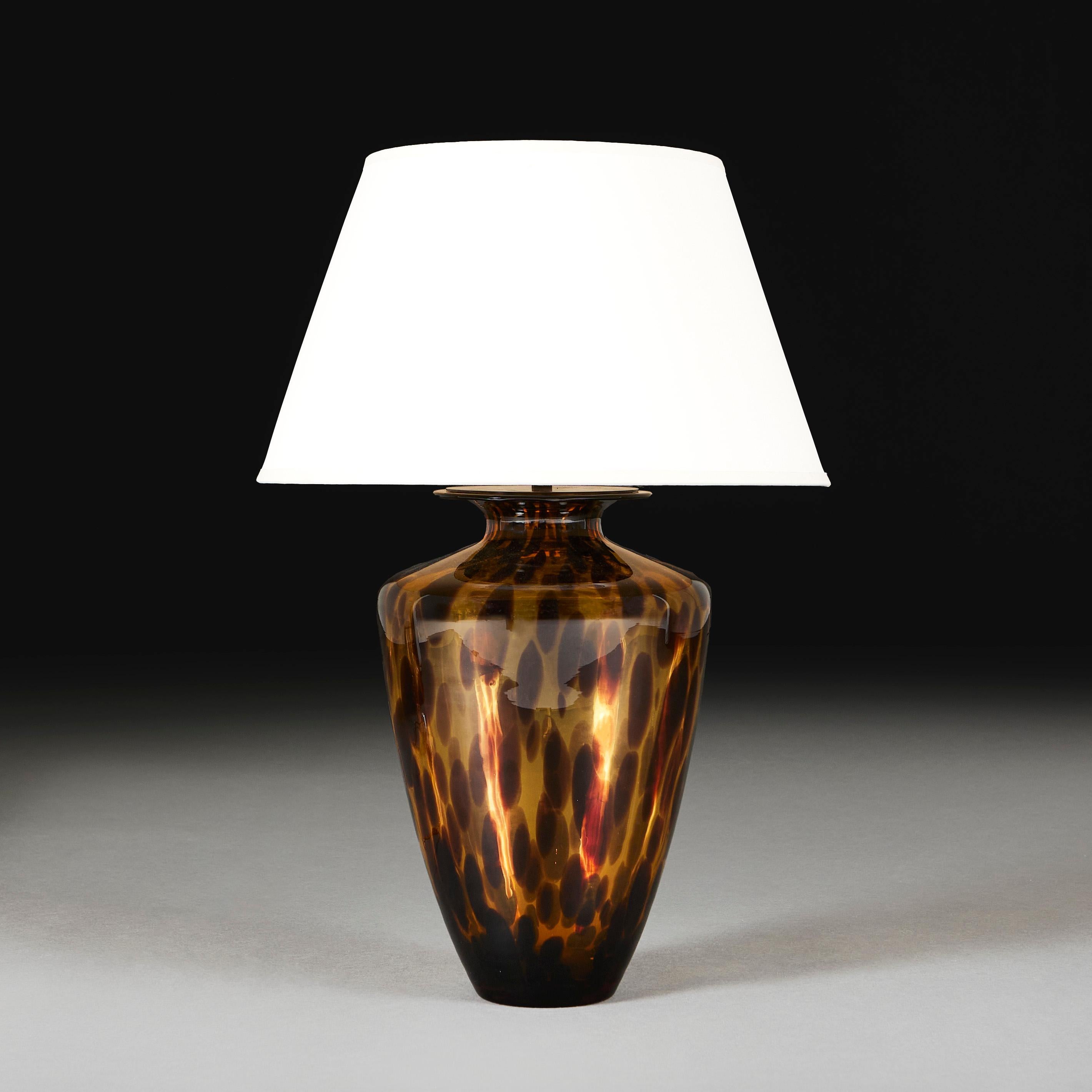 Italy, circa 1960

A mid 20th century Murano glass vase with speckled tortoiseshell pattern and flared rim, now mounted as a lamp. 

Please note: 

Photographed with a 16” diameter pale cream card lampshade.

This is currently wired for the UK with