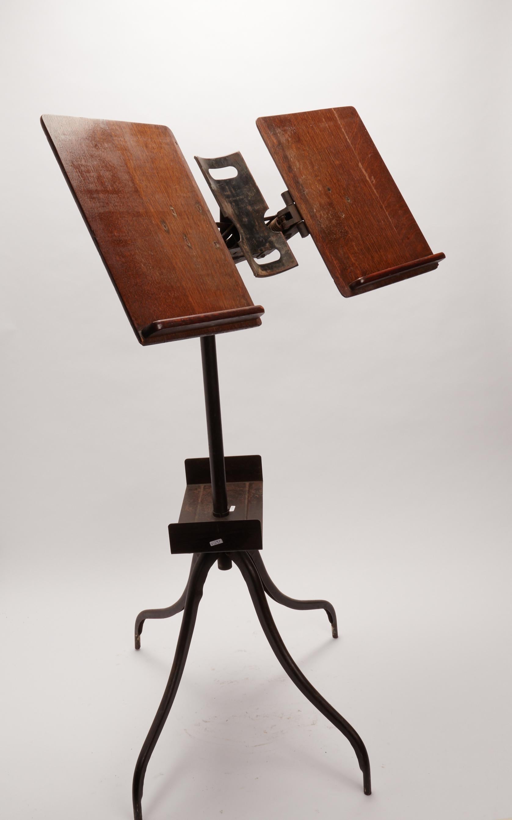 A music score holder, made out of oak wood and iron, with tripod legs. USA 1912 ca.