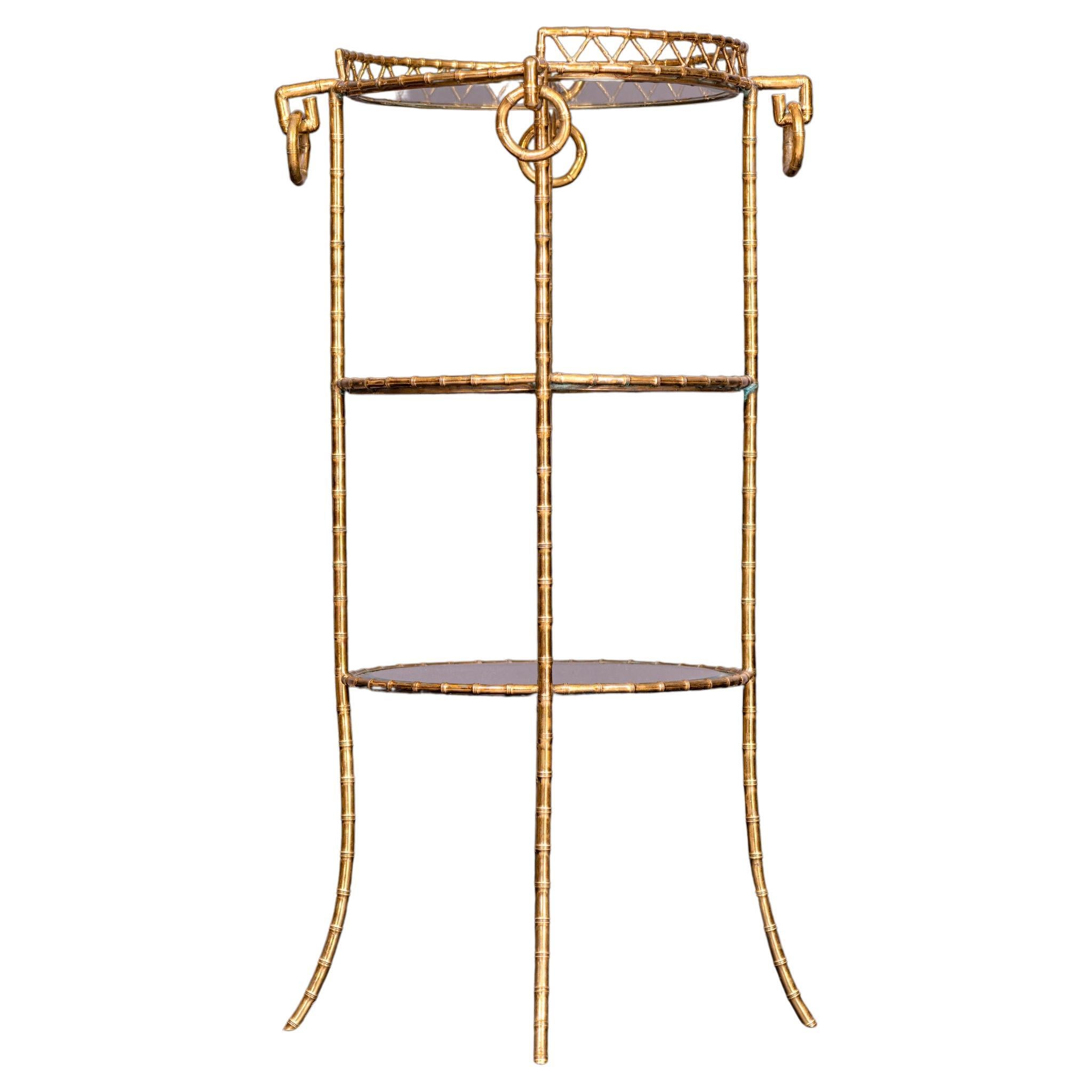 A Napoleon III ormolu and glass etagere by Maison Alphonse Giroux, cast as faux bamboo, with three circular tiers each with a glass shelf, stamped 'MAISON ALPH. GIROUX PARIS' to the top front rim.

Literature:

C. Payne, Paris Furniture: the luxury