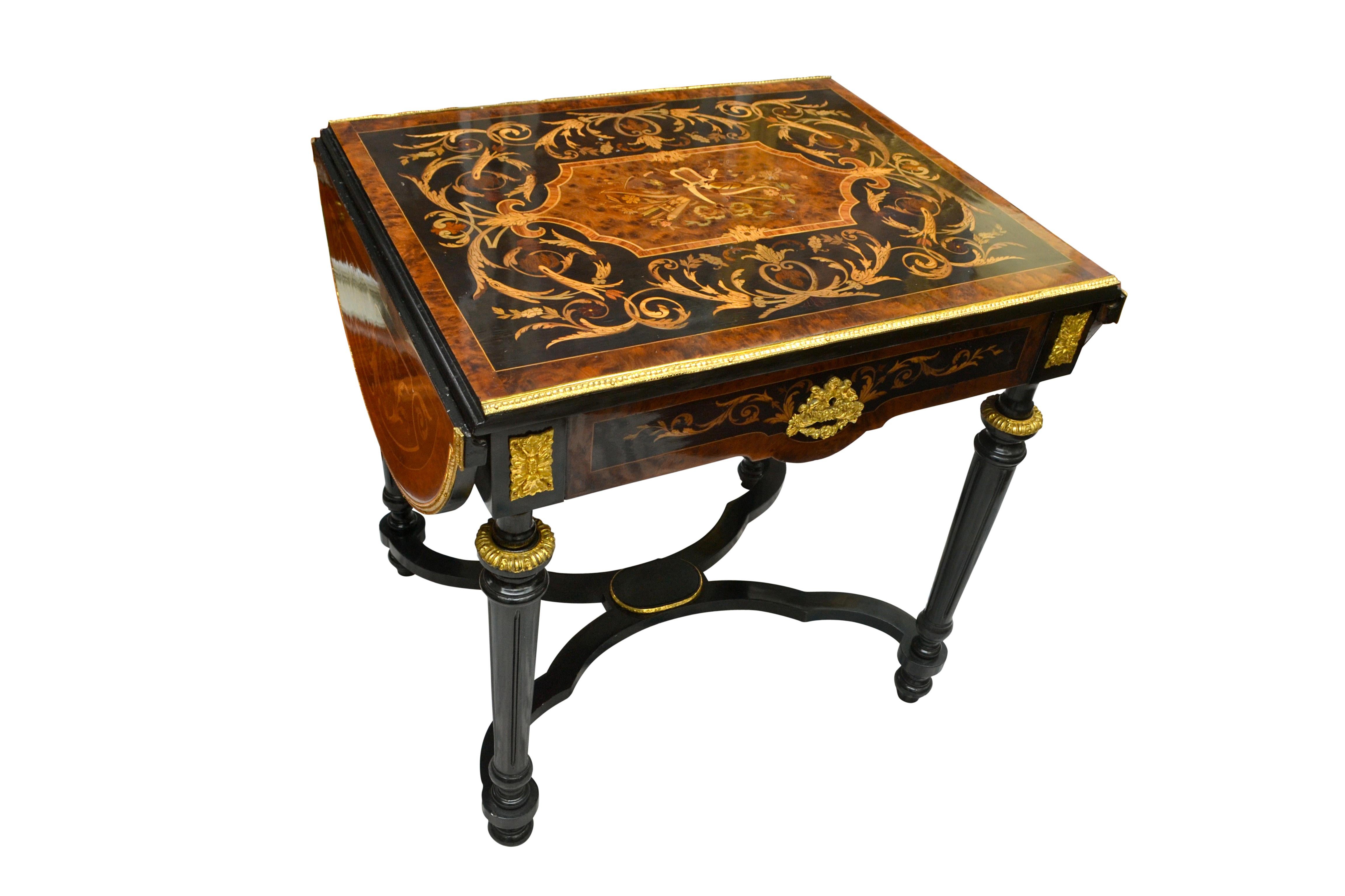 A beautifully inlaid and ebonized French centre table from the Napoleon III Era or third quarter of the 19th century. The table rests on four turned ebonized legs joined at the bottom with a cross stretcher. The exedra shaped top is decorated in