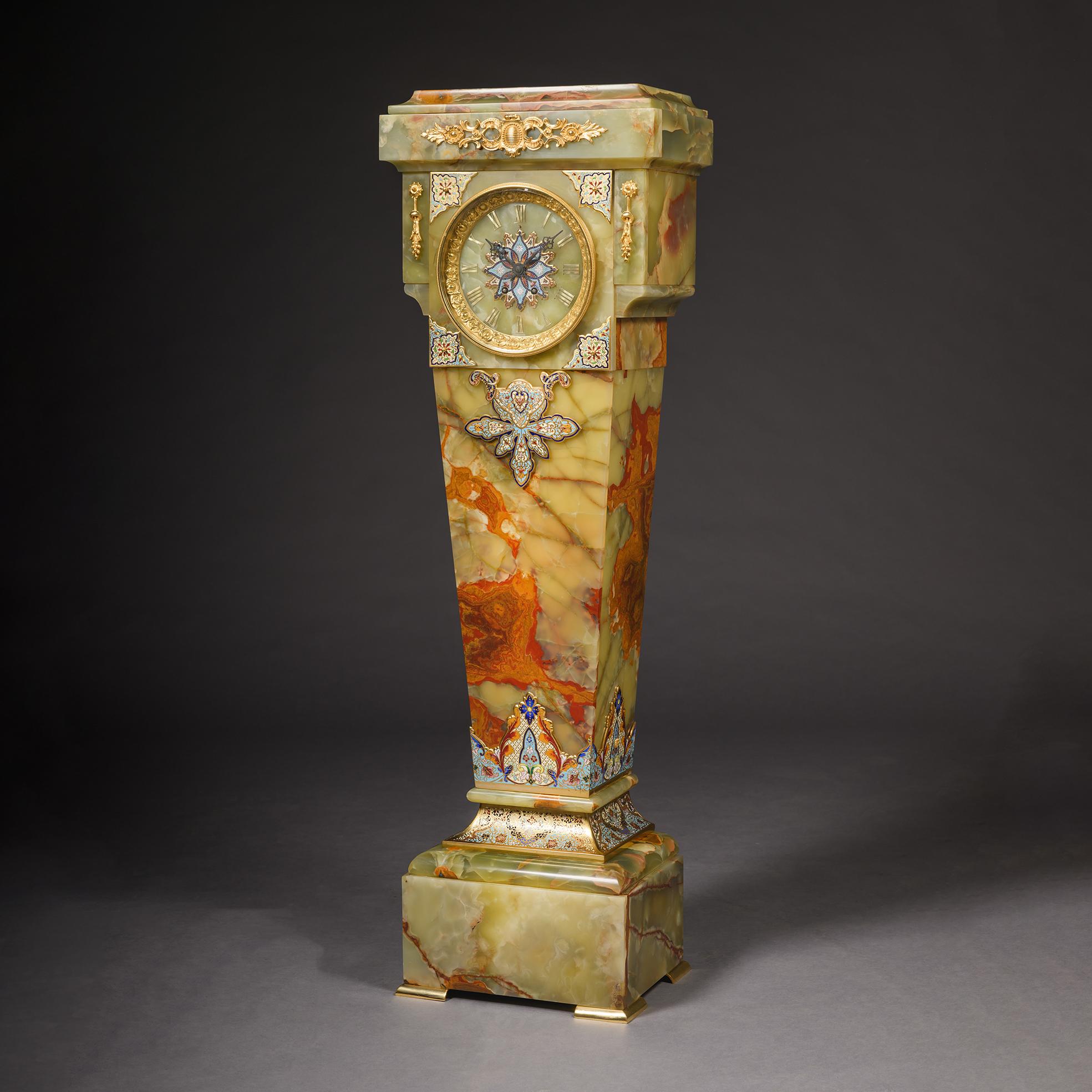A Napoleon III Gilt-Bronze Mounted Onyx and Champlevé Enamel Pedestal Clock. 

The movement with a twin-barrelled eight-day anchor escapement with Brocot-type regulation striking on a bell. Stamped ‘VINCENTI & CIE, MEDAILLE D'ARGENT, 1855’, ‘4557’