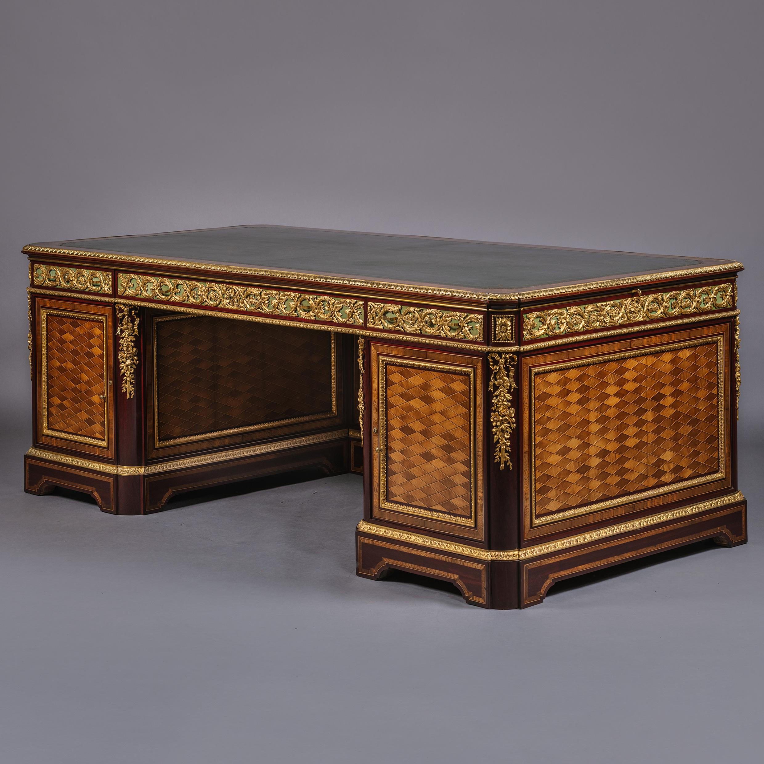 An Important Napoleon III Gilt-Bronze Mounted Parquetry Pedestal Desk, By Guillaume Grohé. France, Circa 1860.

Stamped to the top edge of one door 'GROHE FRERES Ebeniste a PARIS'

Grand in scale and very useable, this impressive pedestal desk is