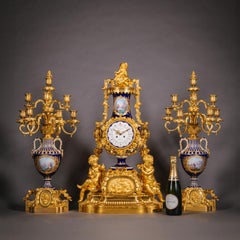 A Napoleon III Period Sèvres Style Porcelain Three-Piece Clock Garniture