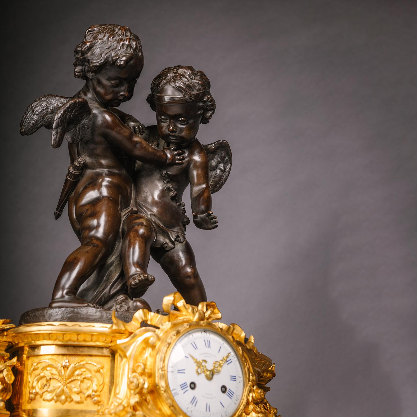 A Napoleon III Gilt and Patinated Bronze Three Pieces Figural Clock Garniture.

By Charpentier & Cie., Paris.

Comprising a mantle clock modelled with playful cherubs with white enamel dial signed ‘Charpentier & Cie, Bronzier, 8, Rue Charlot, Paris’