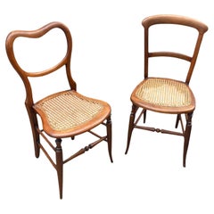A near pair of Beech framed Victorian side chairs with original Bergere seating