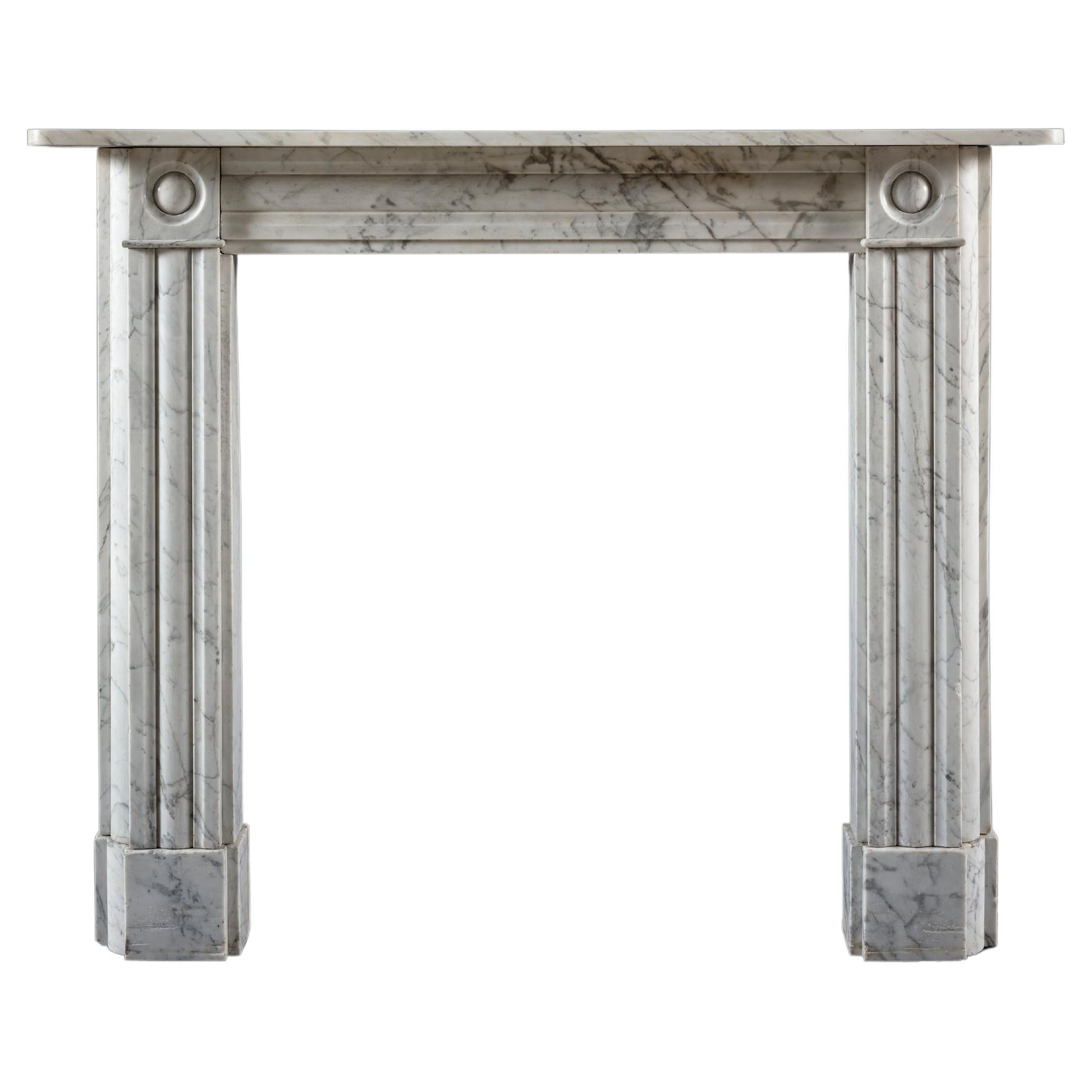 A Near Pair of Classic Regency Bullseye Chimneypiece in Carrara Marble