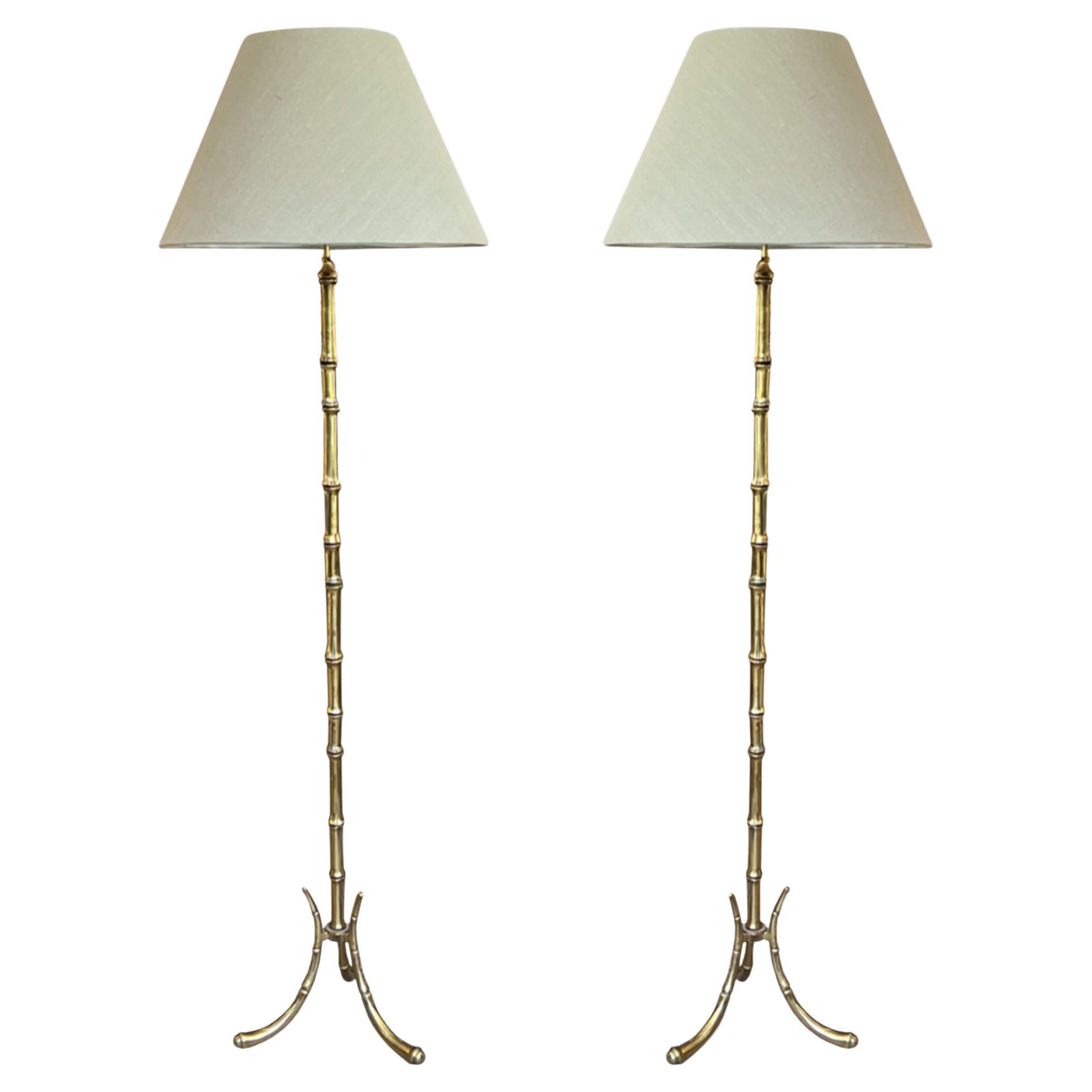 A Near Pair of French 1960s Faux Bamboo Bagués Style Floor Lamps For Sale