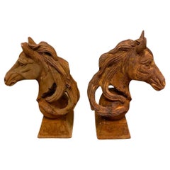 A Near Pair of Large Horse Heads in Cast Iron