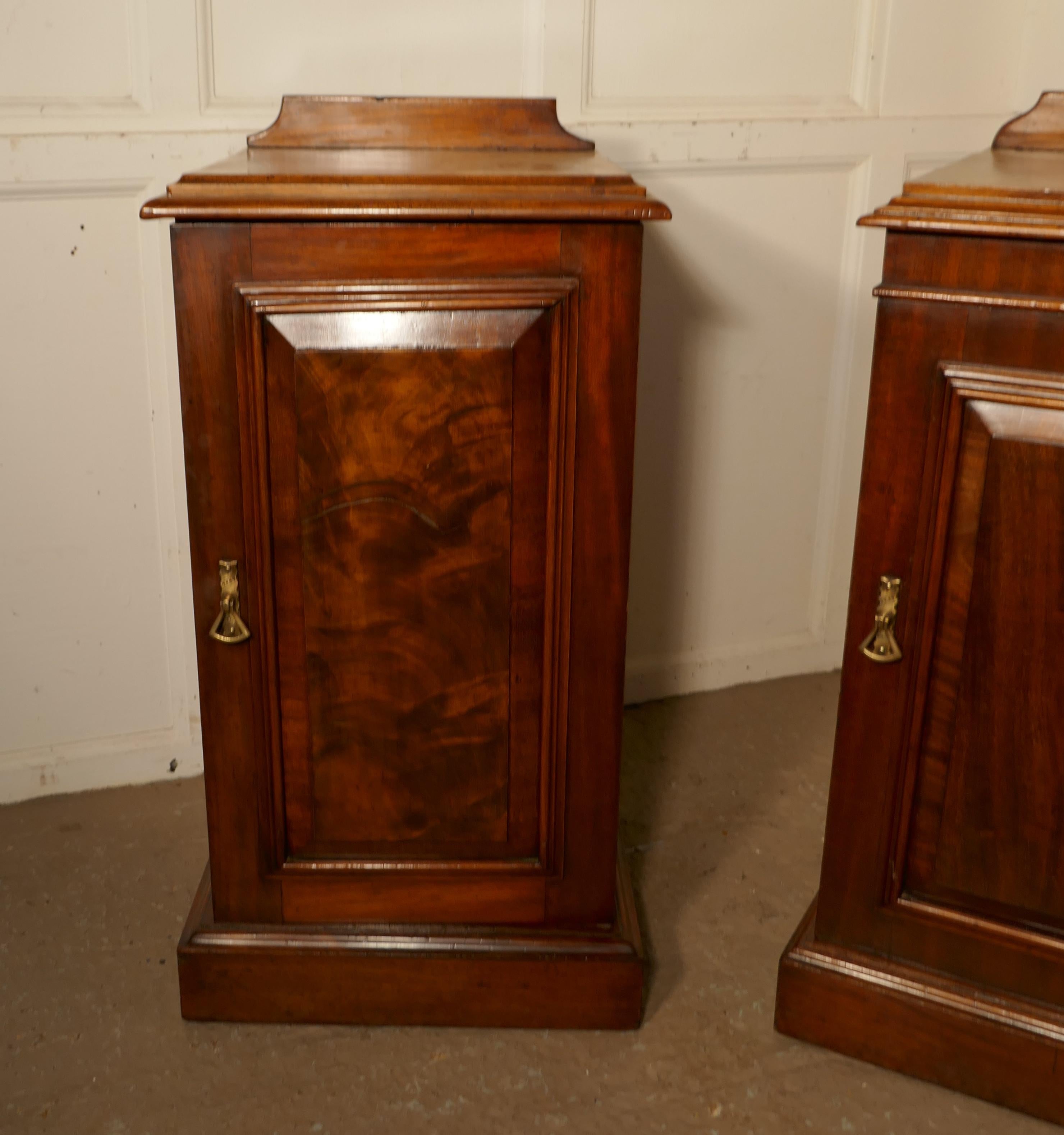 A near pair of Victorian walnut bedside cupboards

These are very good quality cabinets they are not quite identical but very similar
They are made in walnut, each one has a shelved cupboard. 
The door fronts have beautifully figured Walnut