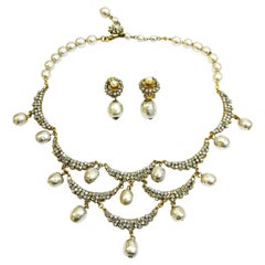 Vintage A necklace and earrings of gilded metal, paste and baroque pearl, Miriam Haskell