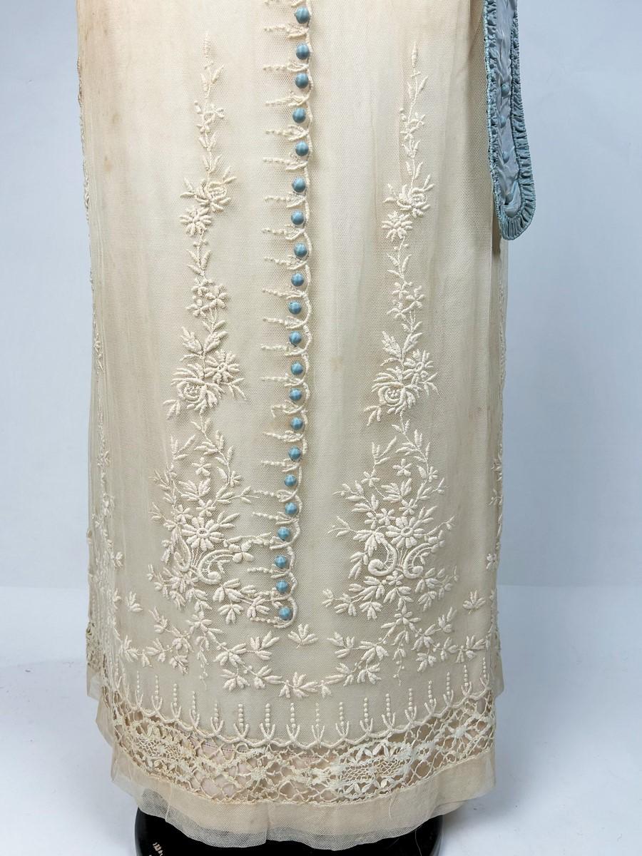 Circa 1910
France
Beautiful neo-classical day dress in the style of the Parisian couturiers of the period. High-waisted dress with boat neckline and short sleeves in mechanically embroidered cotton tulle (which was avant-garde for the period). 