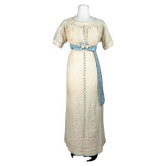 A neo-classical dress in embroidered cotton tulle and taffeta -France Circa 1910