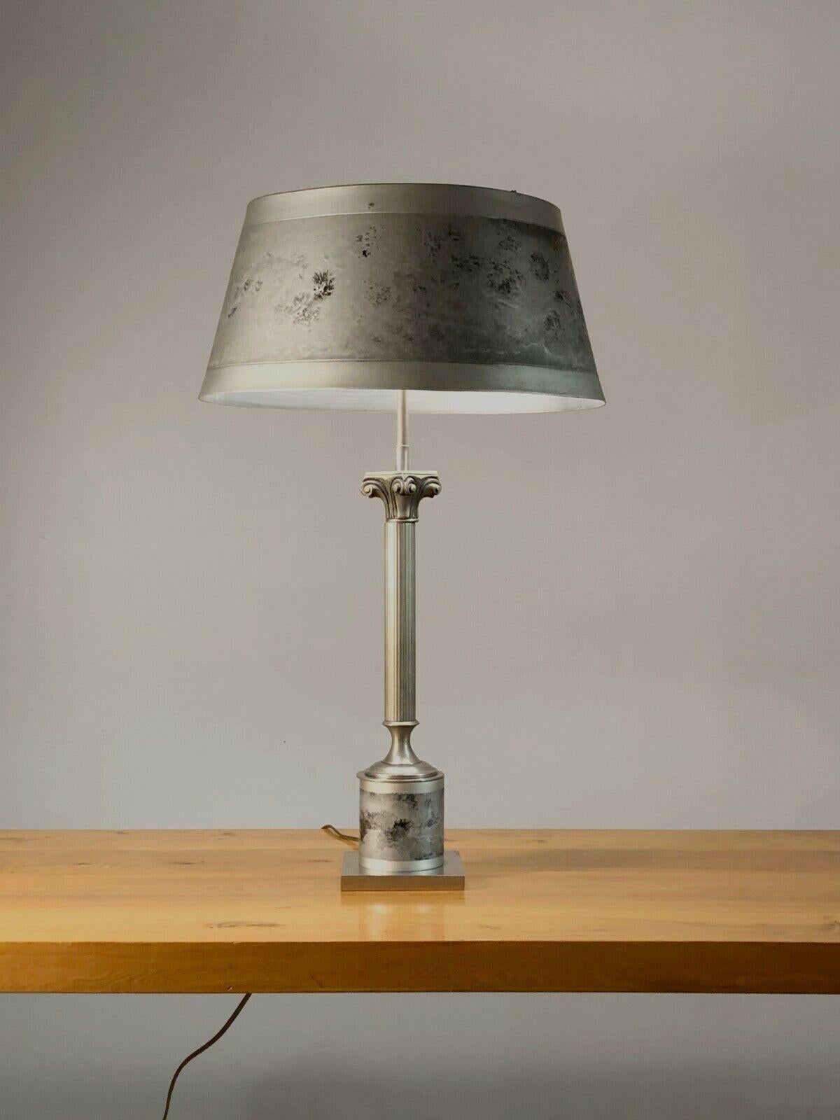 A large and very elegant table lamp, Post-Modernist, Neo-Classical, Shabby-Chic, with an ionic column body, original cylindrical lampshade, with elegant psychedelic metallic decorations, all with superb matt nickel-plated finishes, attributed to