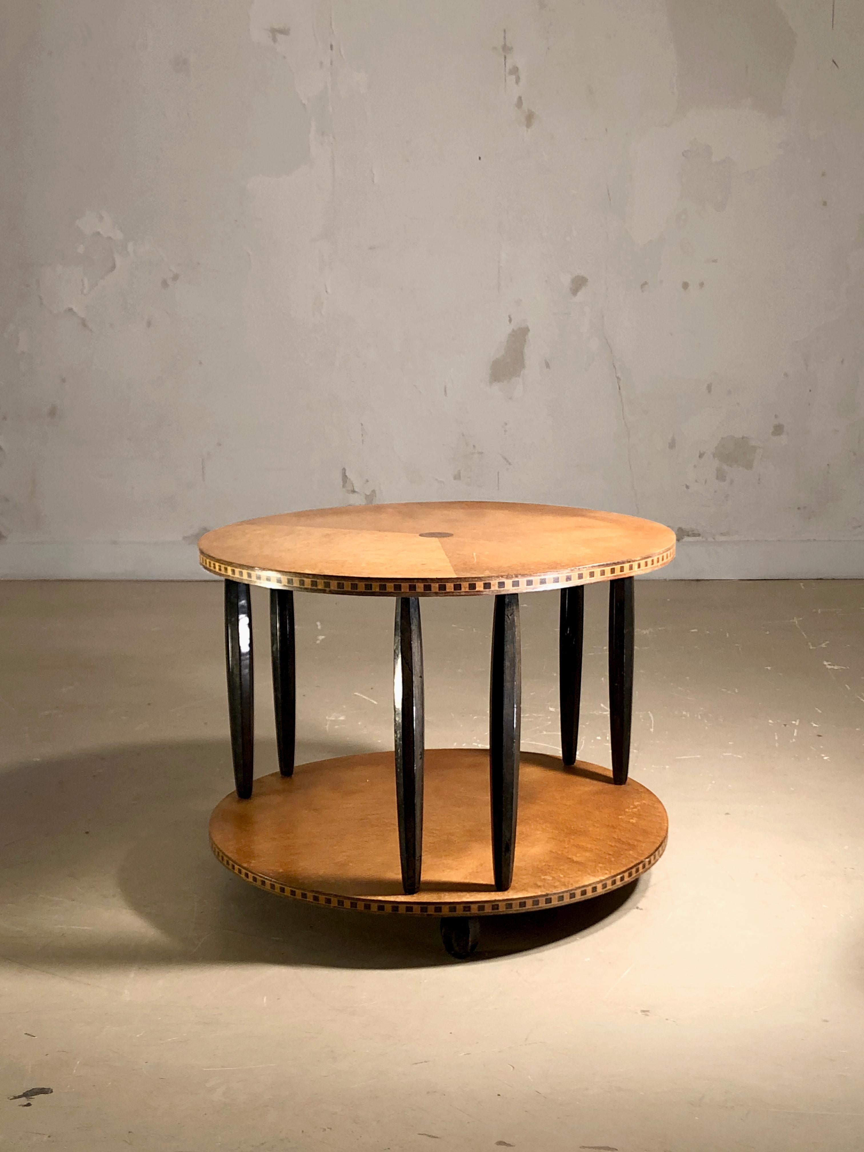 A beautiful and luxurious circular side table, Art Deco, Neo-Classical, with its 2 circular tops connected by 6 elegant tapered legs, in the spirit of Emile-Jacques Ruhlmann and the greatest French designers of the 1930s.

The upper top is