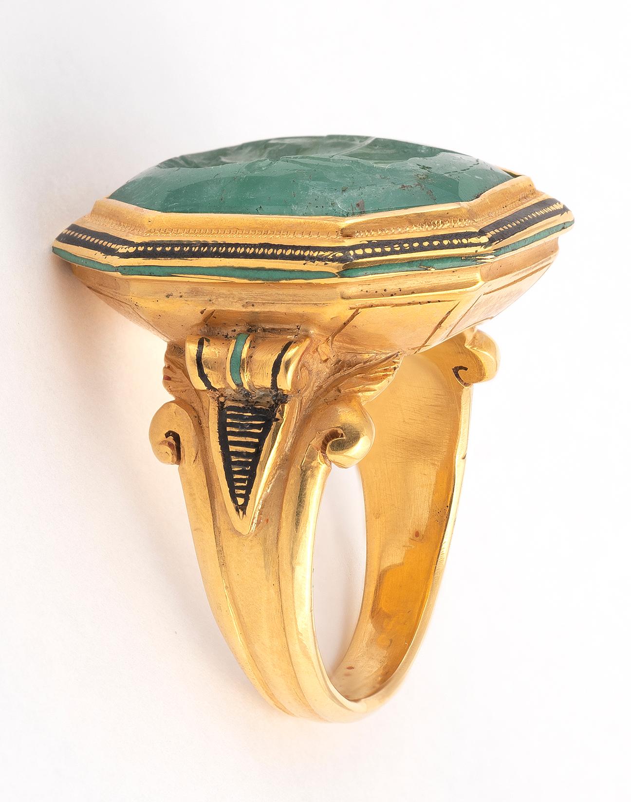 A Neoclassical carved emerald intaglio, depicting Marco Vipsanio Agrippa, the octagonal emerald 1.5cm high, mounted in a later gold ring, size 8 1/2