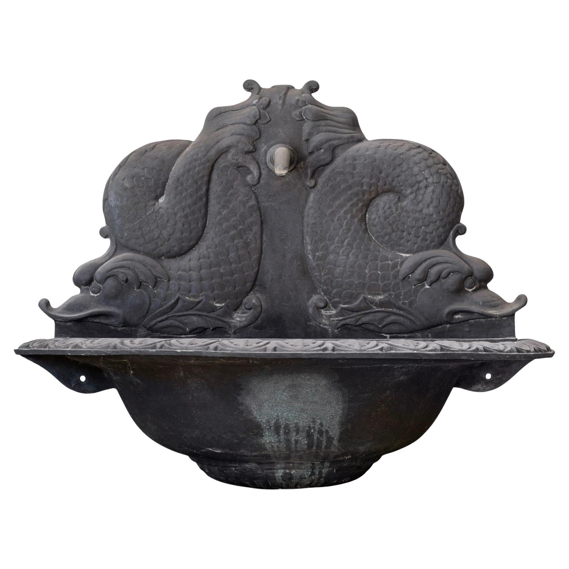 A Neoclassical Style Cast Bronze Dolphin Wall Fountain For Sale