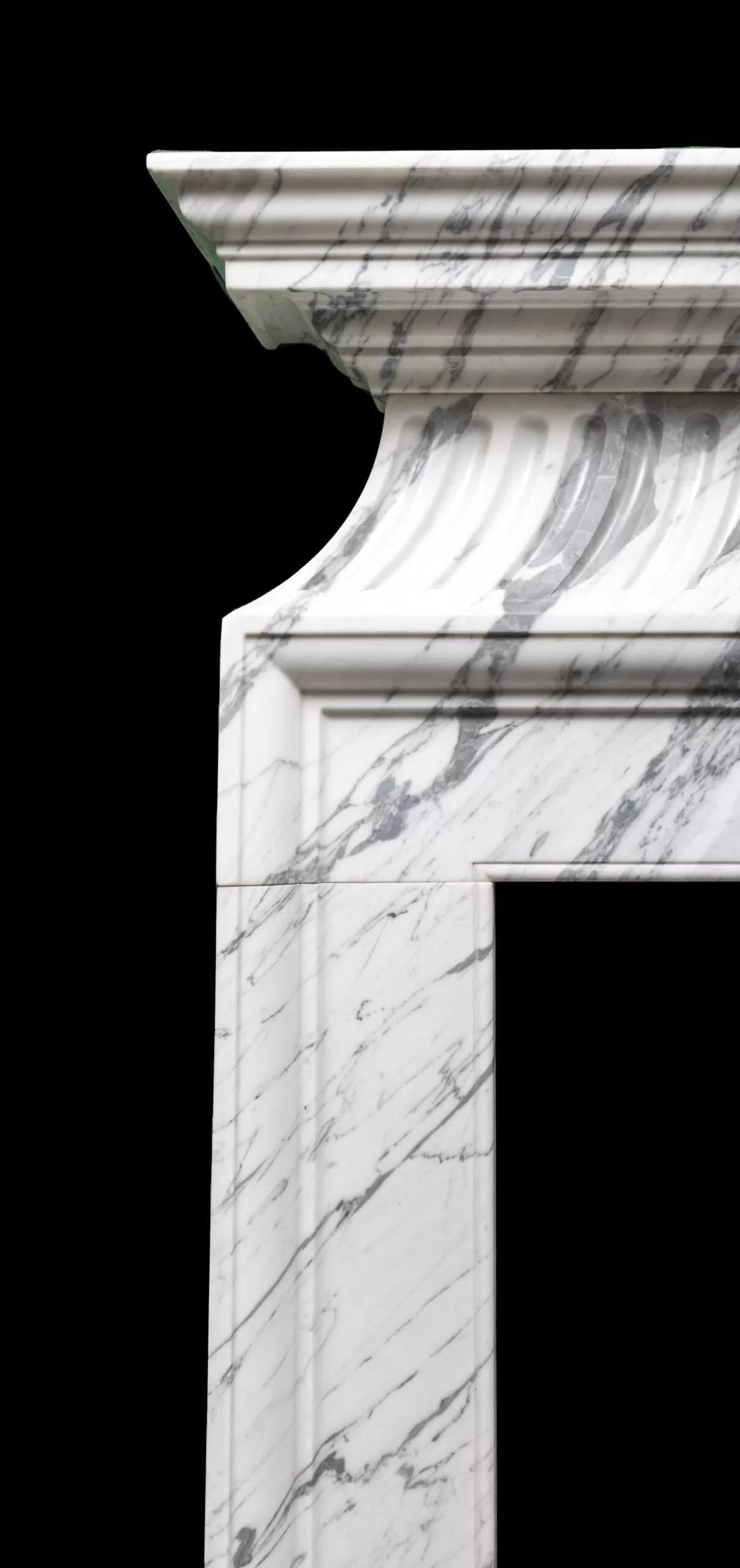 The Chelsea is a tall and elegant neoclassical style fire surround in Italian Carrara marble made by Ryan and Smith.
Modelled straight off an 18th century original chimneypiece, this neoclassical style fire surround in grey veined Carrara marble