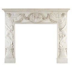 A Neoclassical Style Sculpted White Marble Fireplace Surround