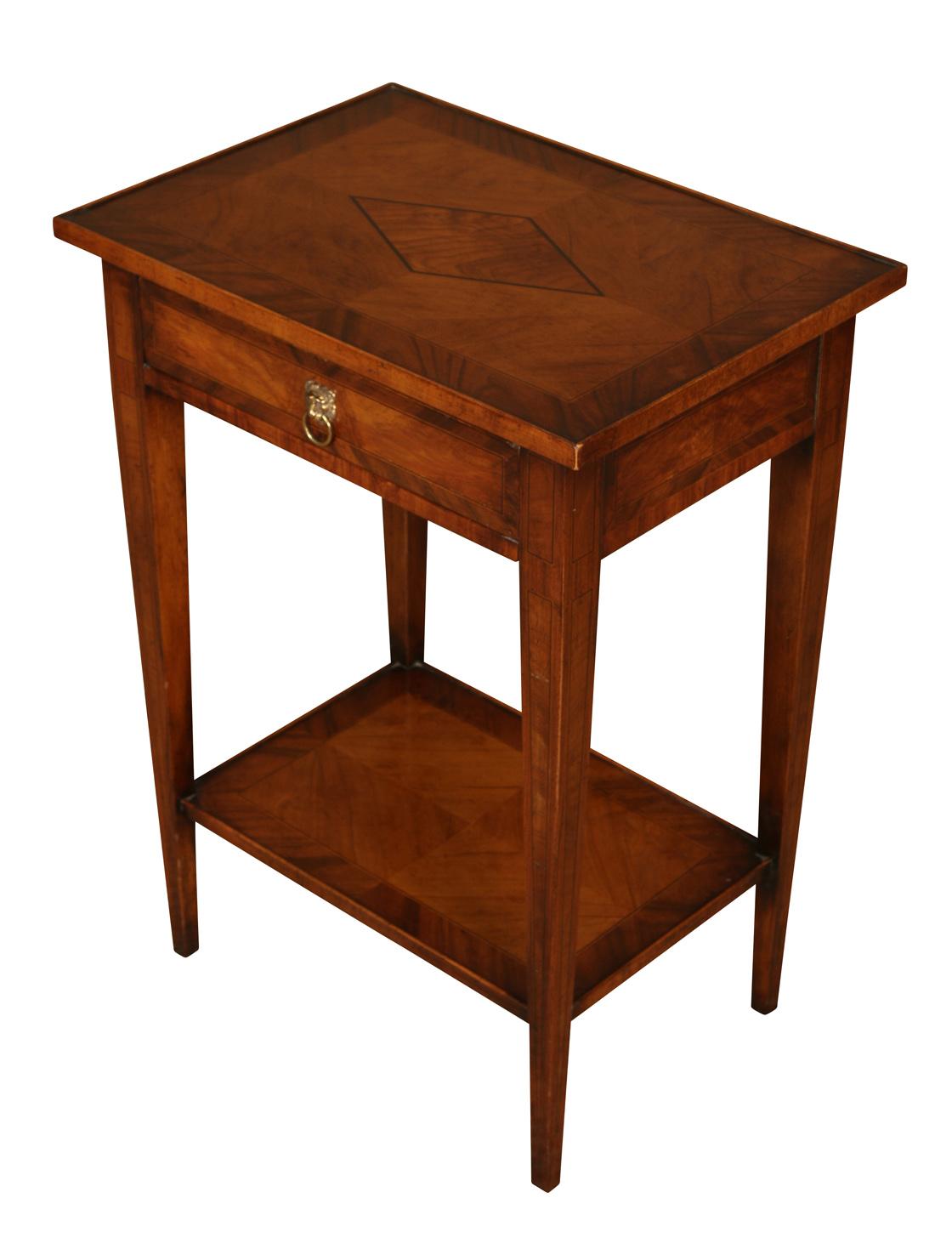 A nice looking little table in walnut with lovely cross banding detailing and an inlaid design on top. This useful little table features a single drawer with a lion's head ring pull and a lower shelf.