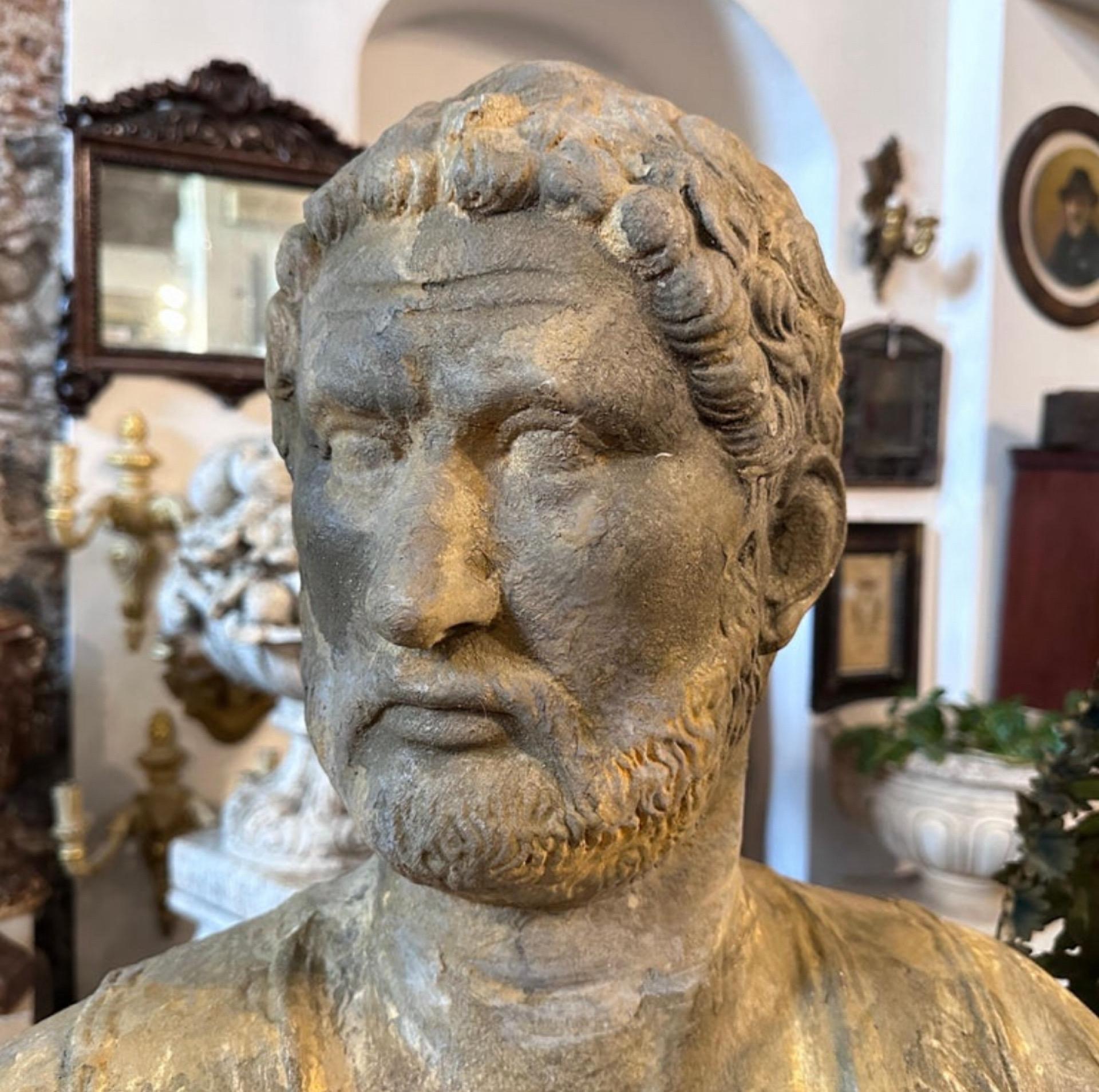 An original patina terracotta bust hand-crafted in Siclly in the first half of 20th century, it has signs of use and age. The bust of the Roman Emperor Adriano is a captivating and finely crafted sculpture that reflects the artistic influences of