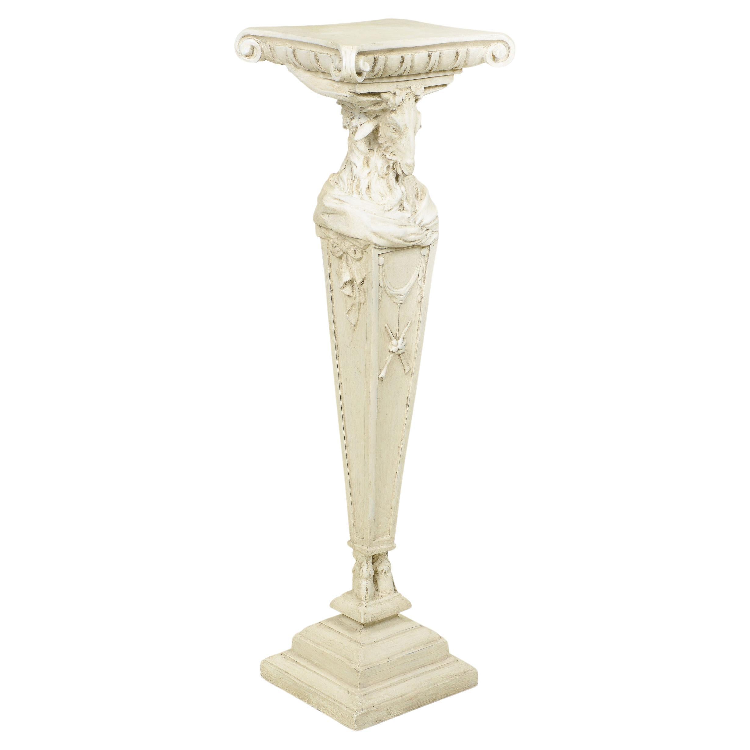 A Neoclassical White-Painted Carved Pedestal