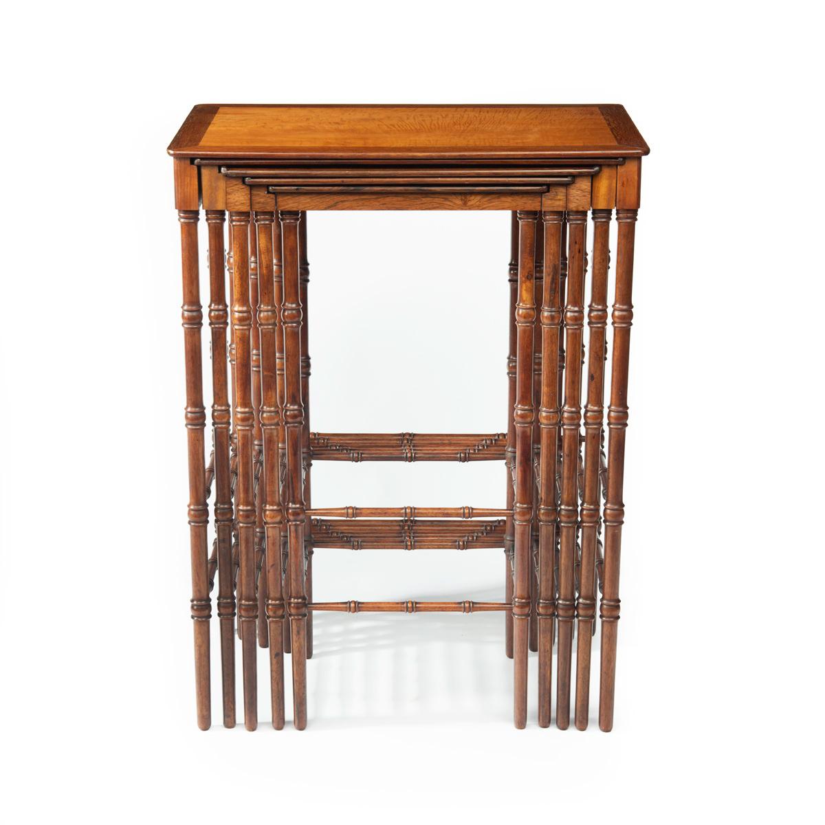 A nest of five Regency specimen wood tables attributed to Gillows, each of rectangular form with solid rosewood frame and finely turned legs joined by paired spindles, each top comprising a solid panel of an exotic wood, the largest table satinwood