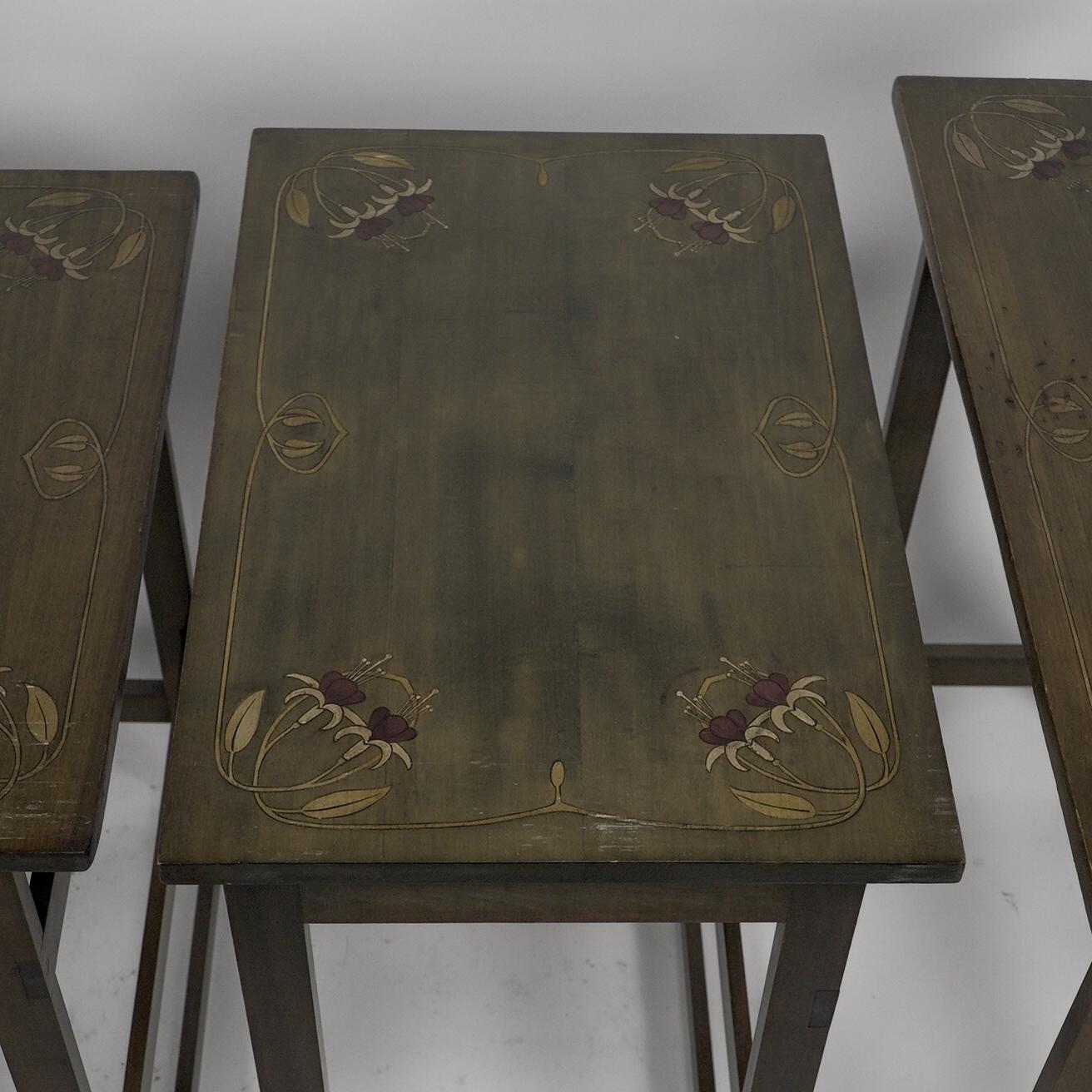 A nest of four side tables each top surface hand painted with floral decoration. For Sale 9