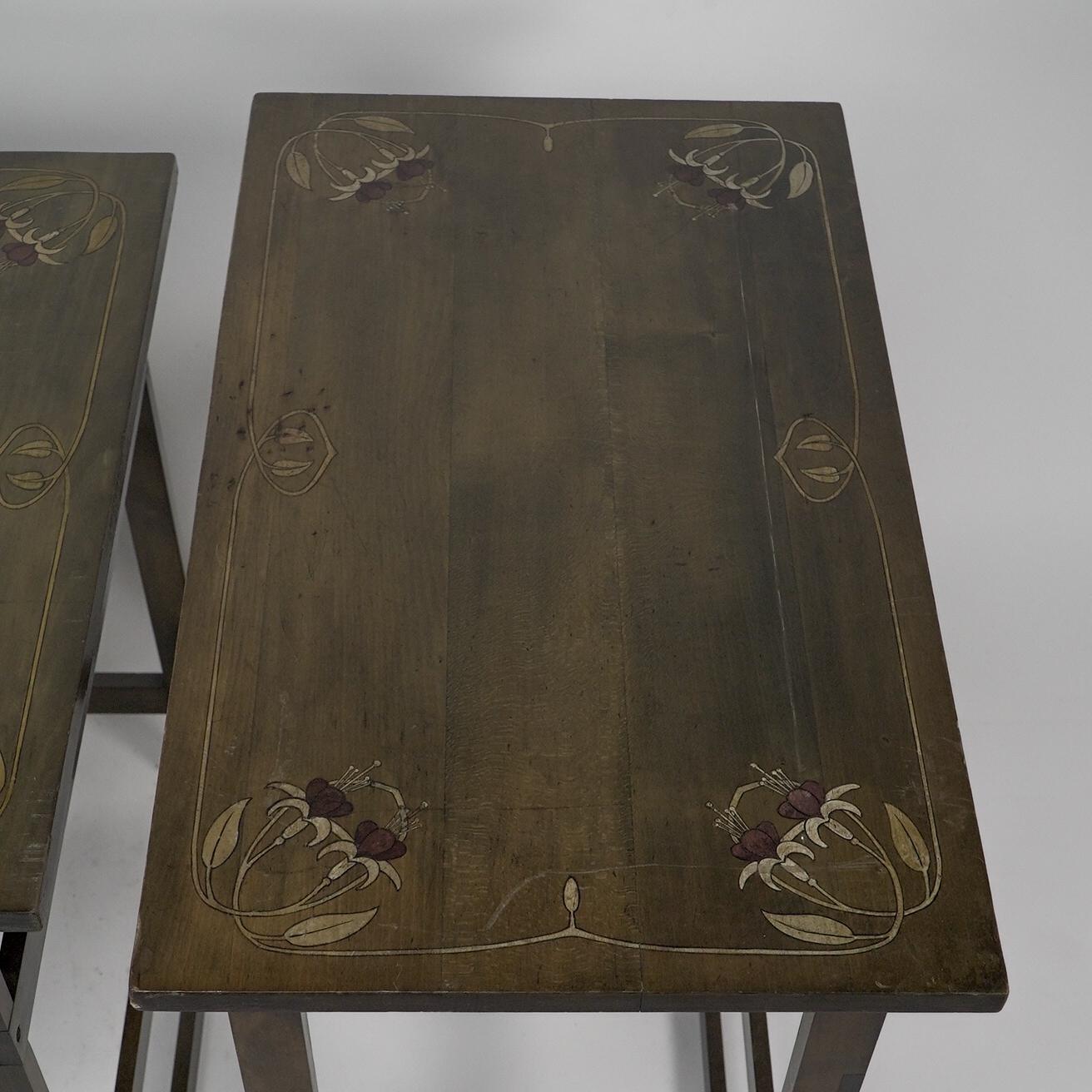 A nest of four side tables each top surface hand painted with floral decoration. For Sale 10