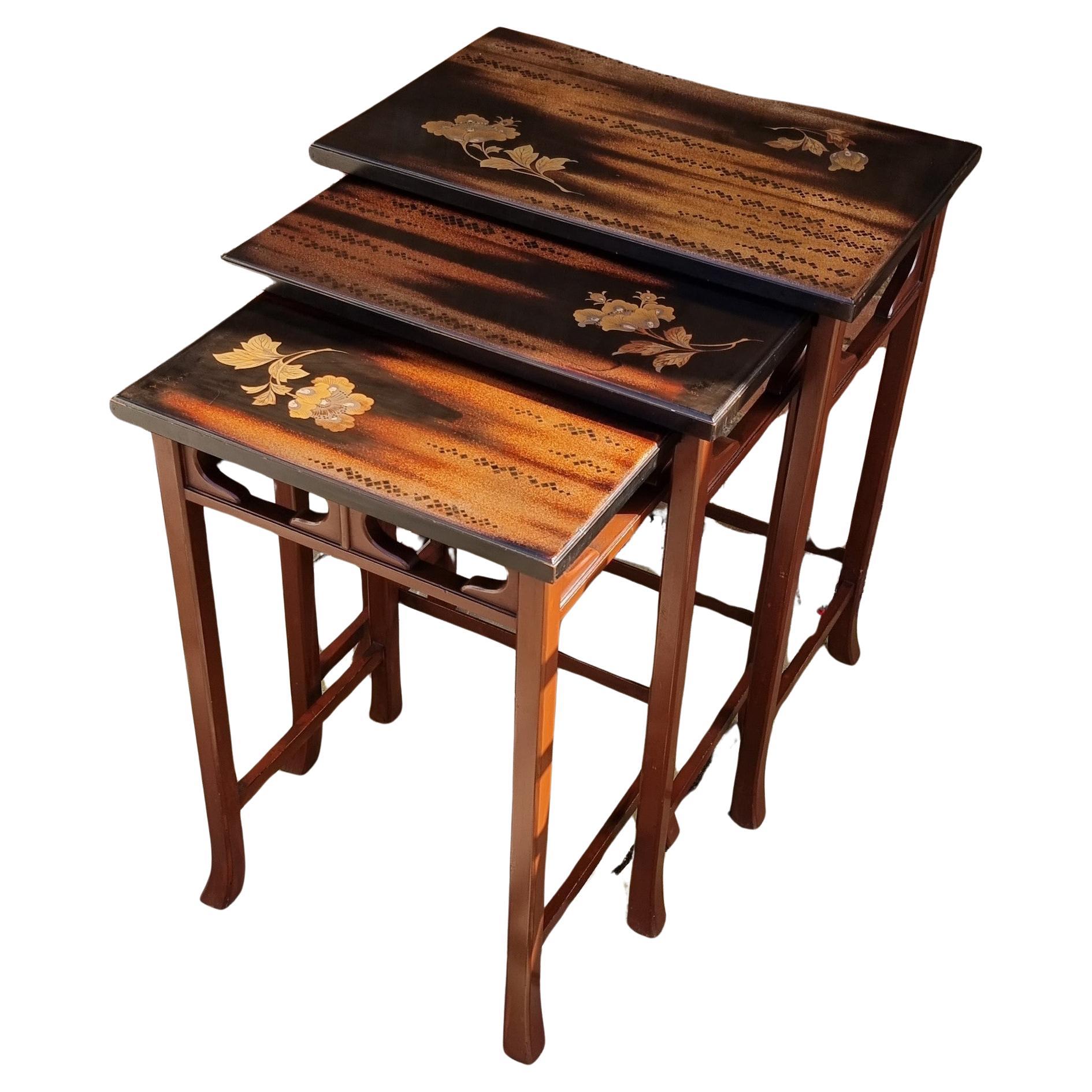 A nest of three Japanese hardwood and lacquer nest of tables circa 1910 For Sale