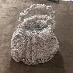 A never used Iridescent Crystal and Ruched White Leather Mesh Bag by Gedebe