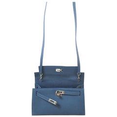 A new Pochette bag blue leather with shoulder strap 
