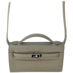a new Pochette bag taub leather with shoulder strap 
