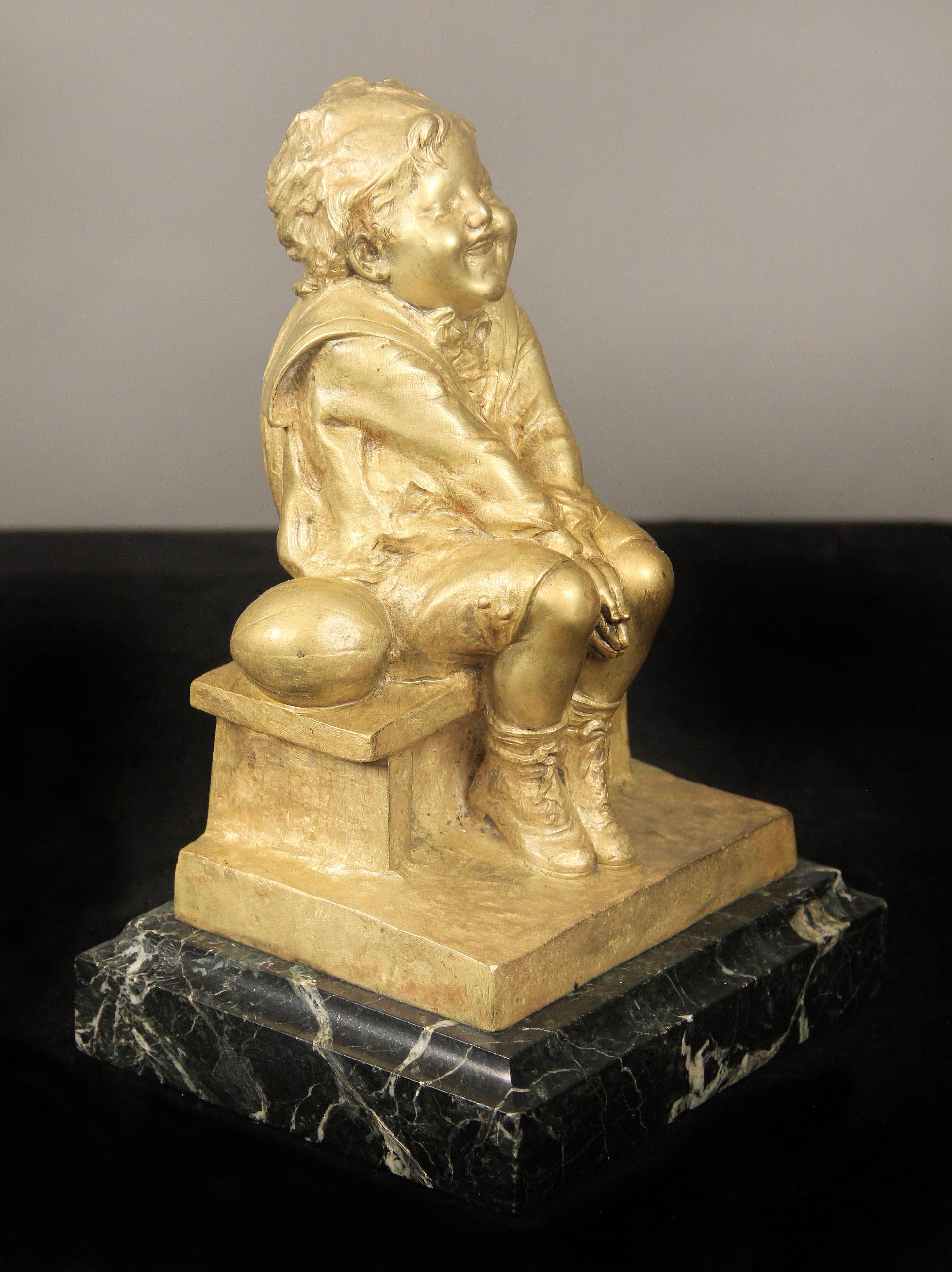 A nice early 20th century gilt bronze sculpture of a child seated on a marble base

By Juan Clara

Signed Juan Clara and stamped 39/1421 AH.

Juan Clara (1875-1958), born in Olot near Girona, is a Spanish sculptor who is famous for mainly