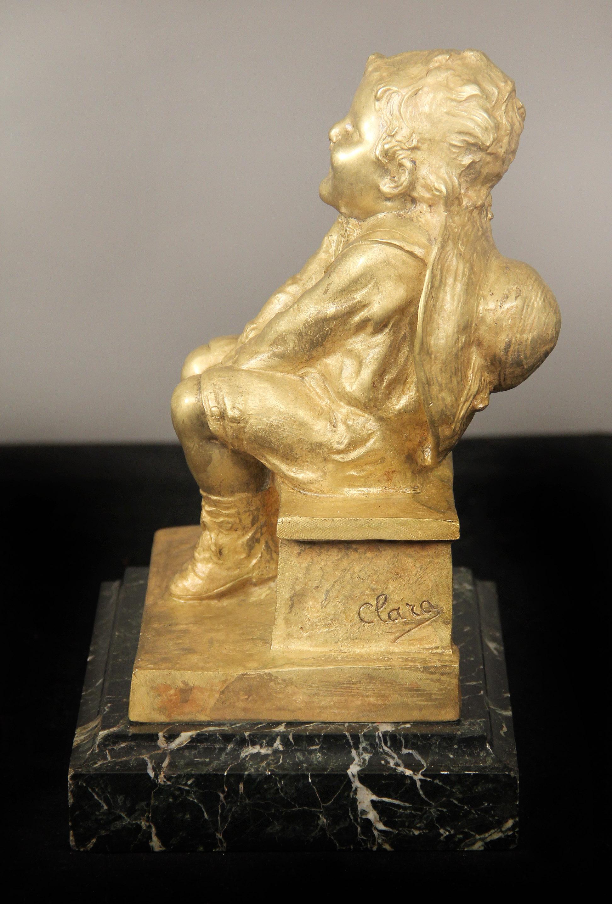 Belle Époque Nice Gilt Bronze Sculpture of a Child Seated on a Marble Base by Juan Clara For Sale