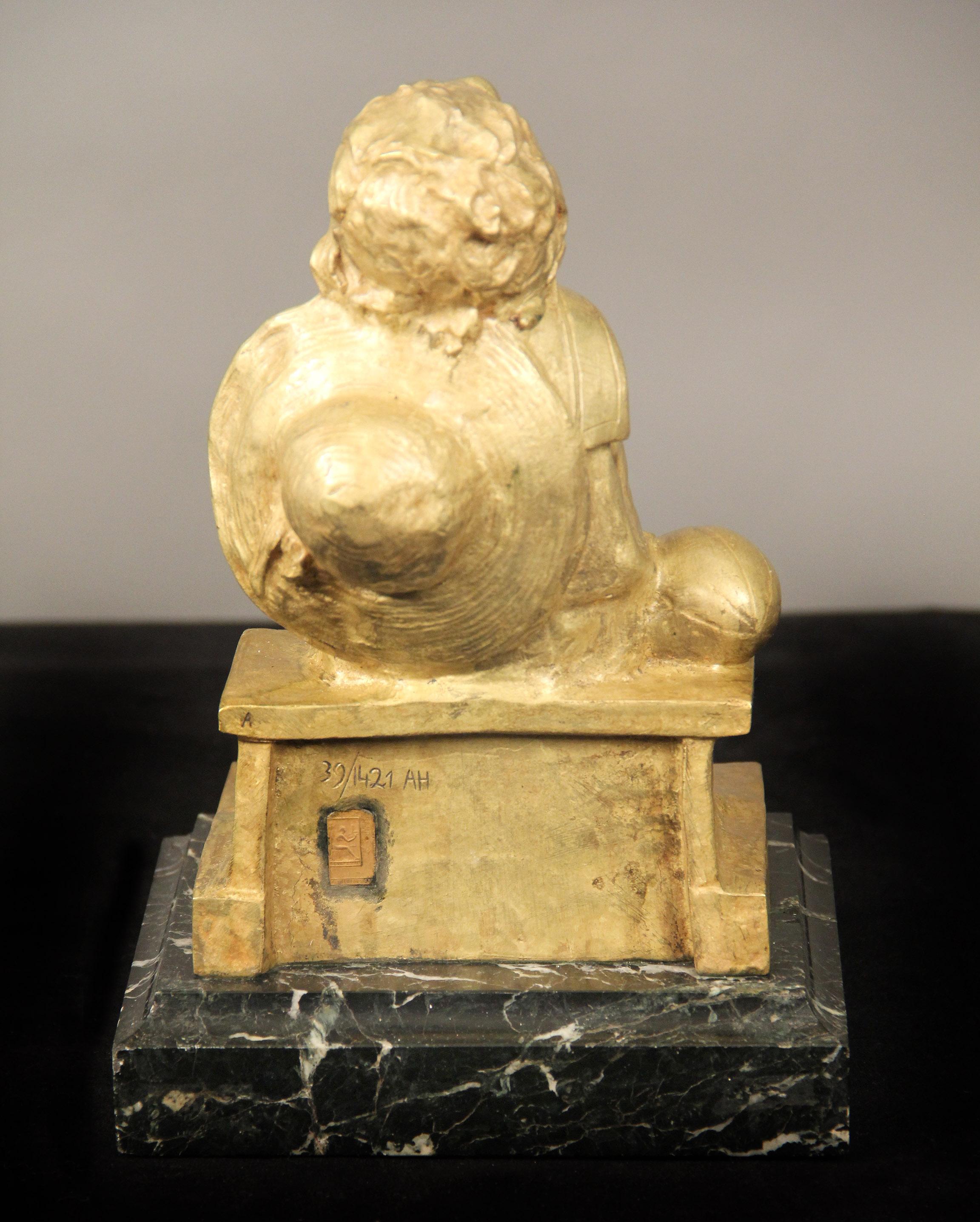 Spanish Nice Gilt Bronze Sculpture of a Child Seated on a Marble Base by Juan Clara For Sale